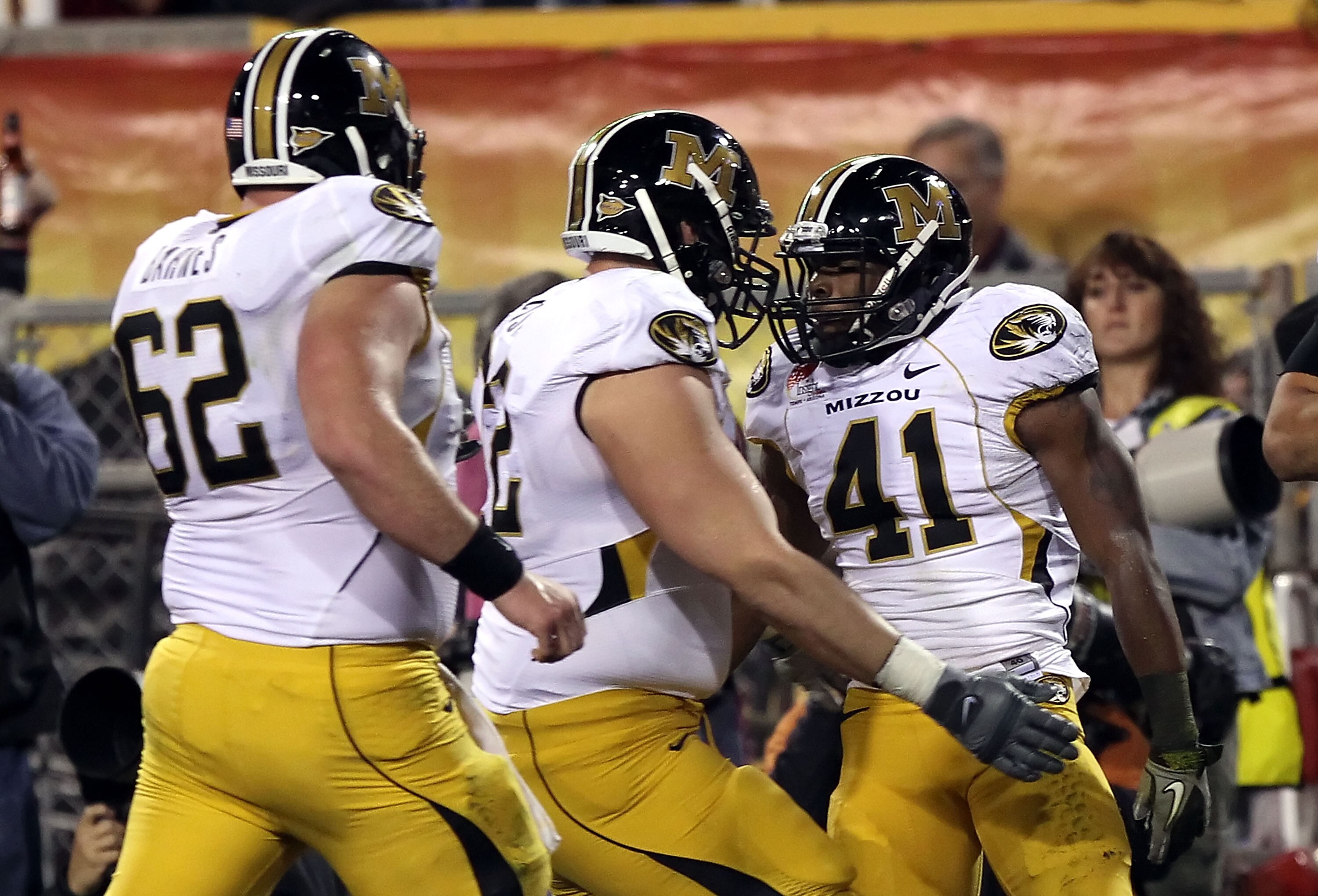 TEMPE, AZ - DECEMBER 28:  Runningback Henry Josey #41 of the Missouri Tigers celebrates with teammates after scoring on a 10 yard rushing touchdown against the Iowa Hawkeyes during the second quarter of the Insight Bowl at Sun Devil Stadium on December 28