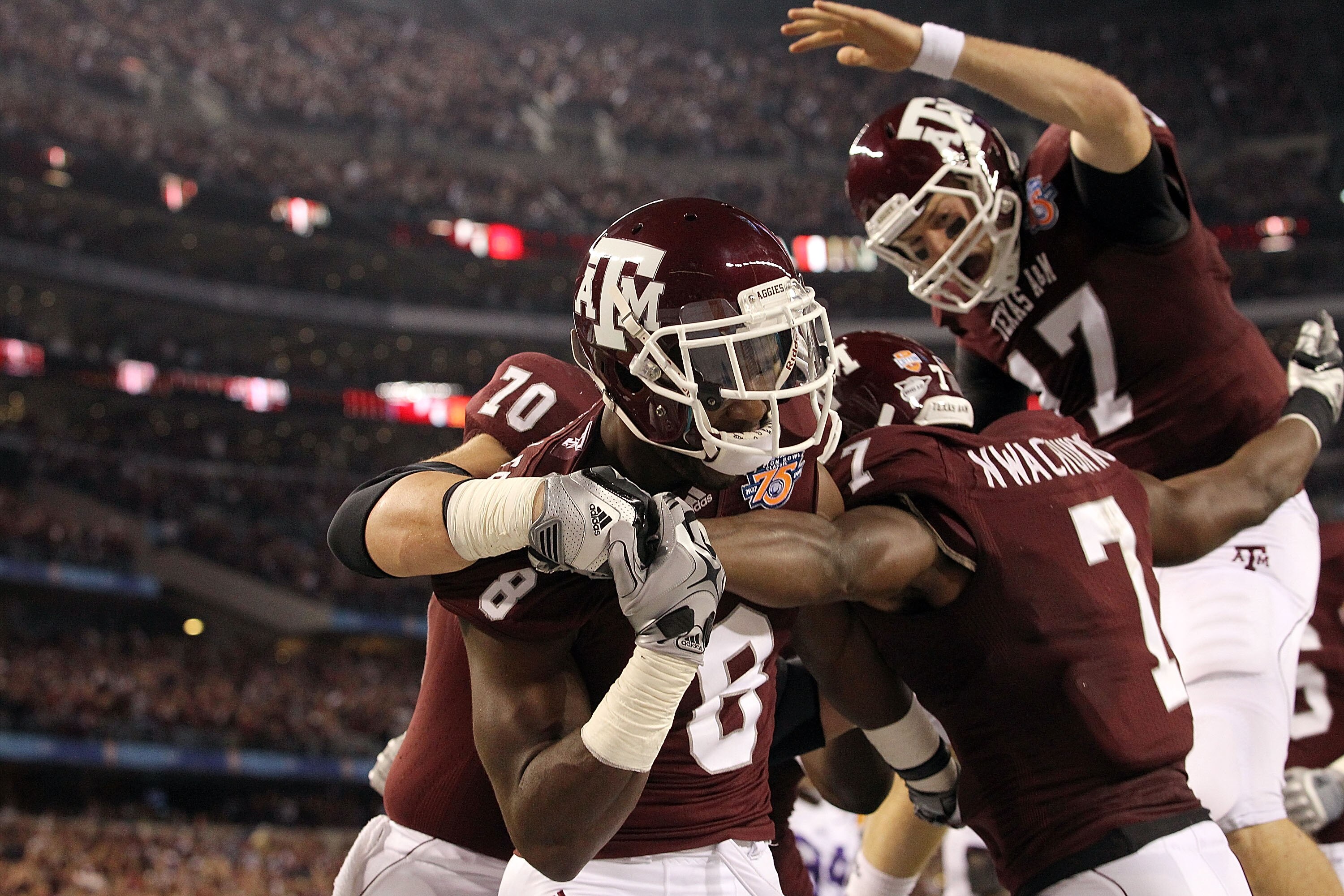 ARLINGTON, TX - JANUARY 07:  Wide receiver Jeff Fuller #8 and Uzoma Nwachukwu #7 of the Texas A&M Aggies celebrate a touchdown against the LSU Tigers during the AT&T Cotton Bowl at Cowboys Stadium on January 7, 2011 in Arlington, Texas.  (Photo by Ronald