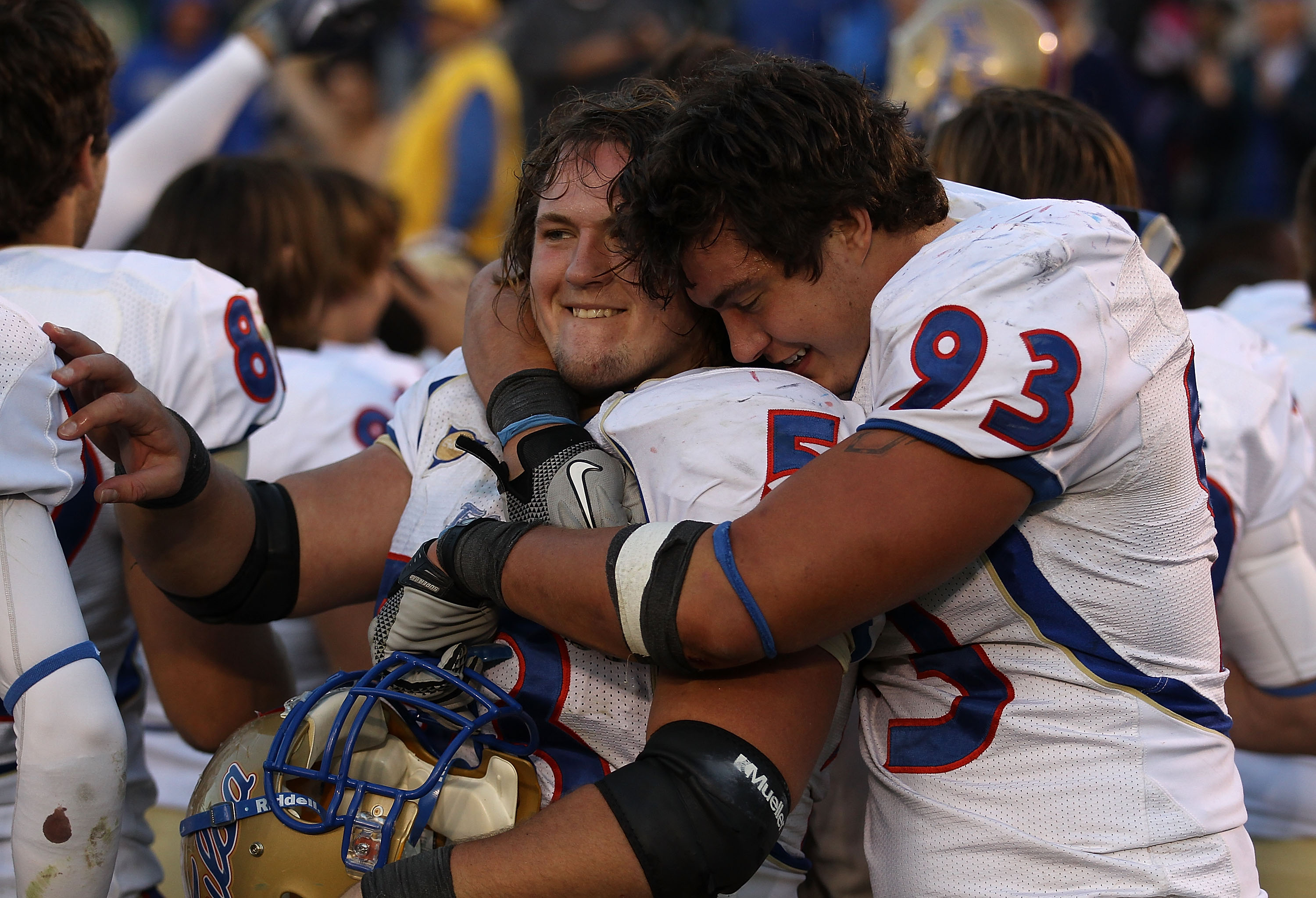 SOUTH BEND, IN - OCTOBER 30: Cory Dorris #93 of the Tulsa Golden Hurricane hugs teammate Trent Dupy #53 after a win over the Notre Dame Fighting Irish at Notre Dame Stadium on October 30, 2010 in South Bend, Indiana. Tulsa defeated Notre Dame 28-27. (Phot
