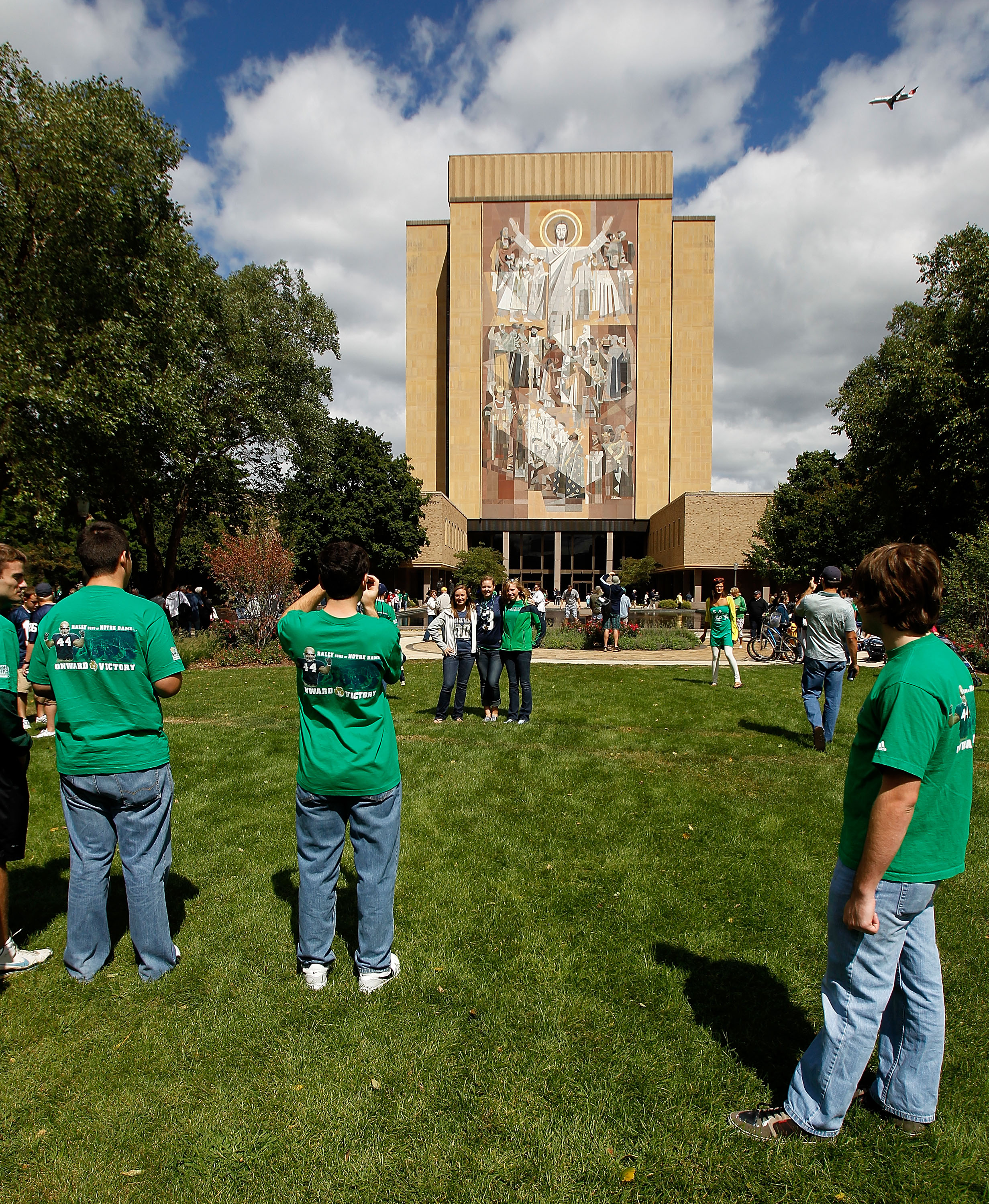 SOUTH BEND, IN - SEPTEMBER 04: Fans take pictures in front of the 'Way of Life' mural, also known as 'Touchdown Jesus,' on the campus of Notre Dame University before a game between the Notre Dame Fighting Irish and the Purdue Boilermakers at Notre Dame St