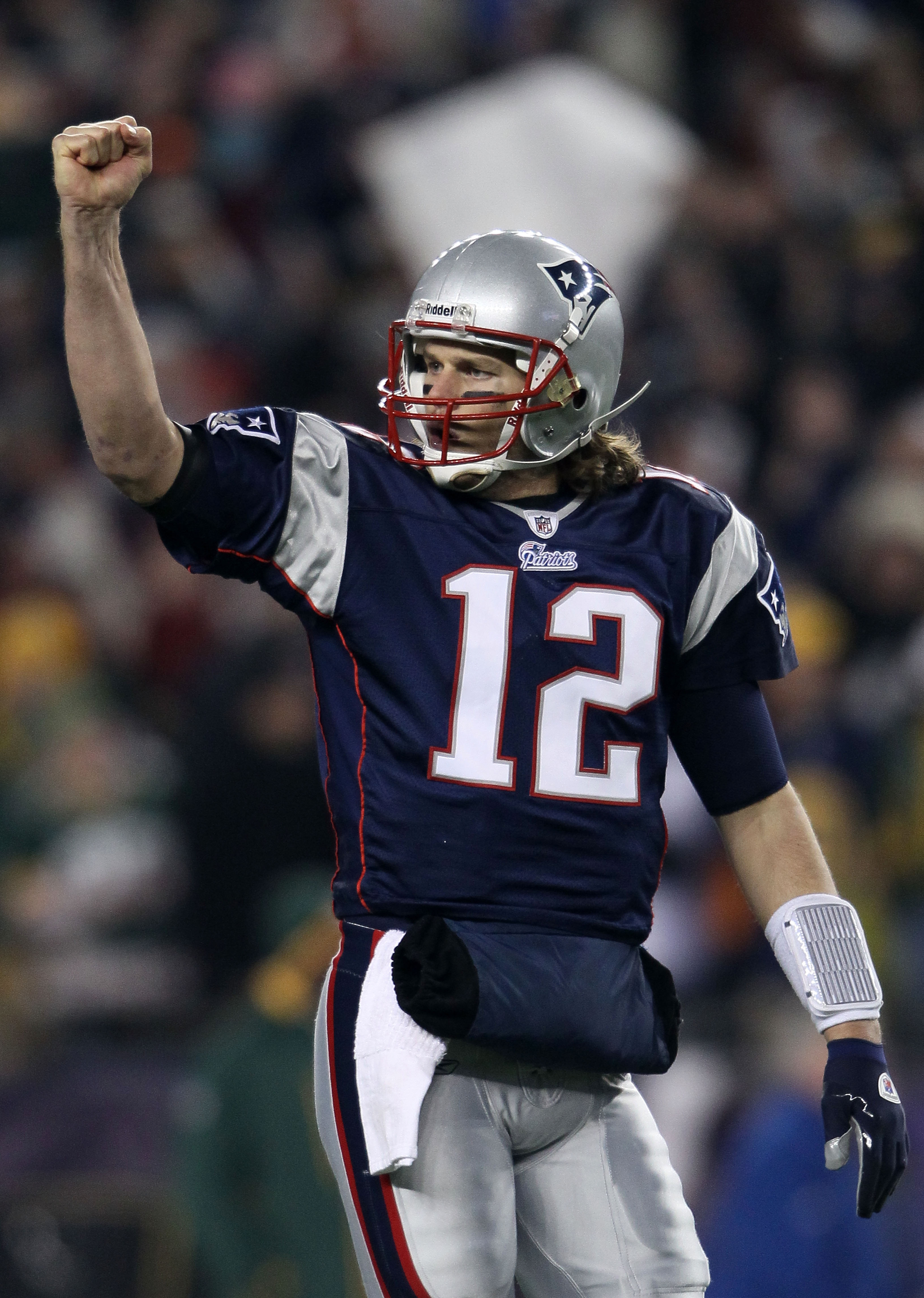 FOXBORO, MA - DECEMBER 19:  Quarterback Tom Brady #12 of the New England Patriots celebrates a touchdown scored by running back BenJarvus Green-Ellis #42 (not pictured) against the Green Bay Packers in the first quarter of the game at Gillette Stadium on