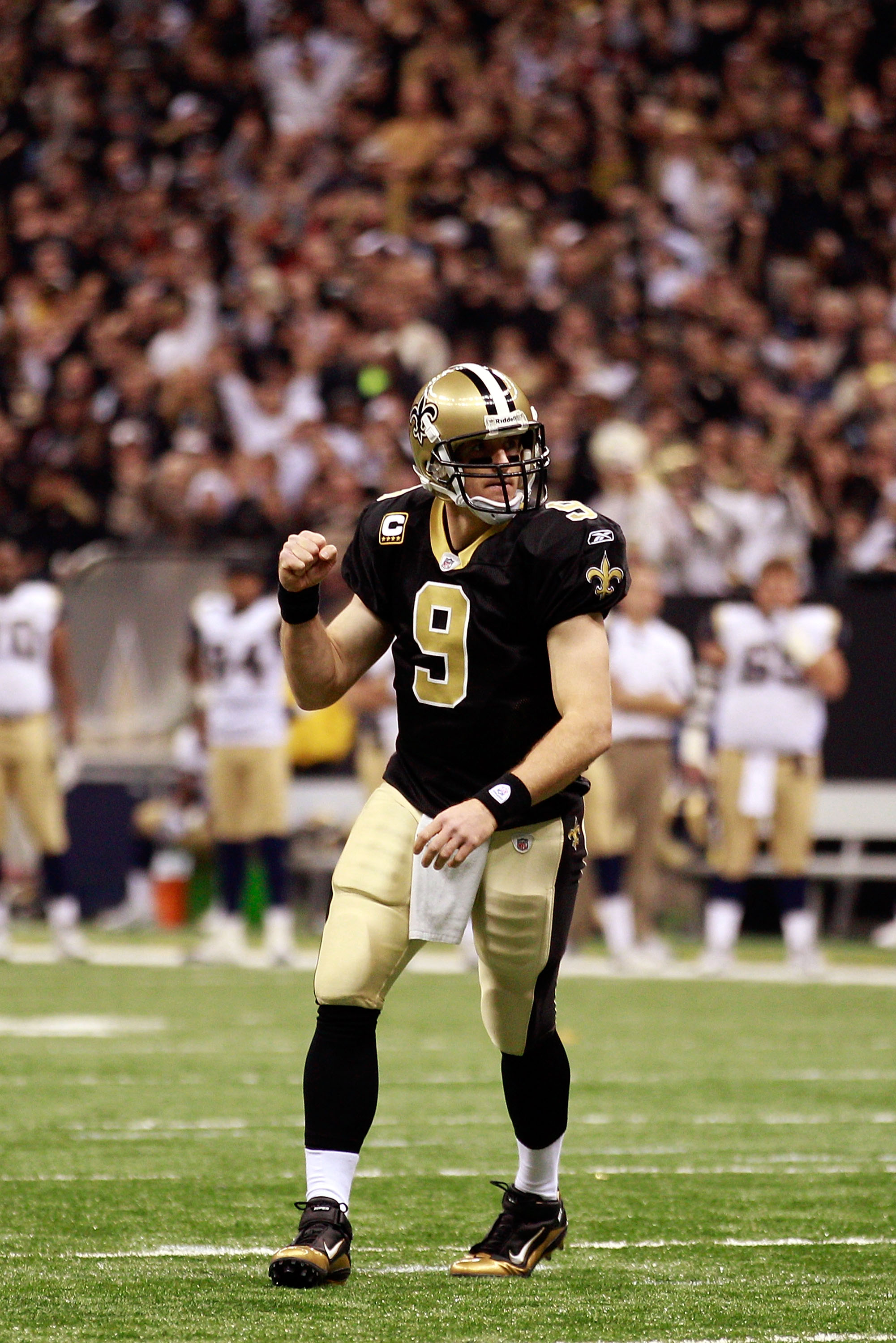 NEW ORLEANS, LA - DECEMBER 12:  Drew Brees #9 of the New Orleans Saints celebrates after scoring a touchdown against the St. Louis Rams at the Louisiana Superdome on December 12, 2010 in New Orleans, Louisiana. The Saints defeated the Rams 31-13.  (Photo