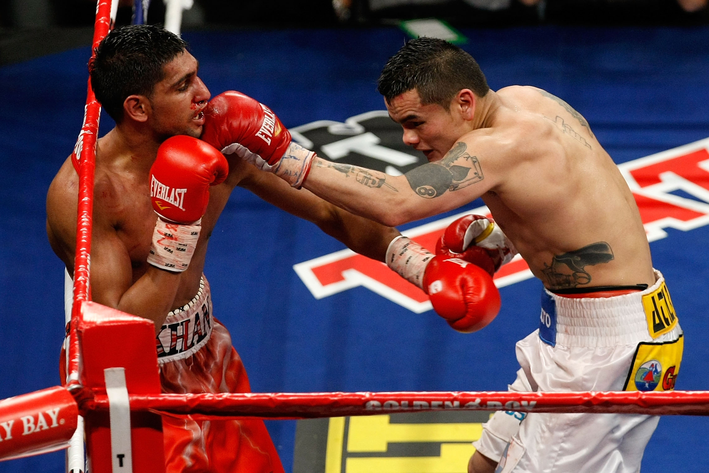 LAS VEGAS - DECEMBER 11: (R-L) Marcos Maidana of Argentina connects with a left at Amir Khan of England during the WBA super lightweight title fight at Mandalay Bay Events Center on December 11, 2010 in Las Vegas, Nevada. (Photo by Ethan Miller/Getty Im