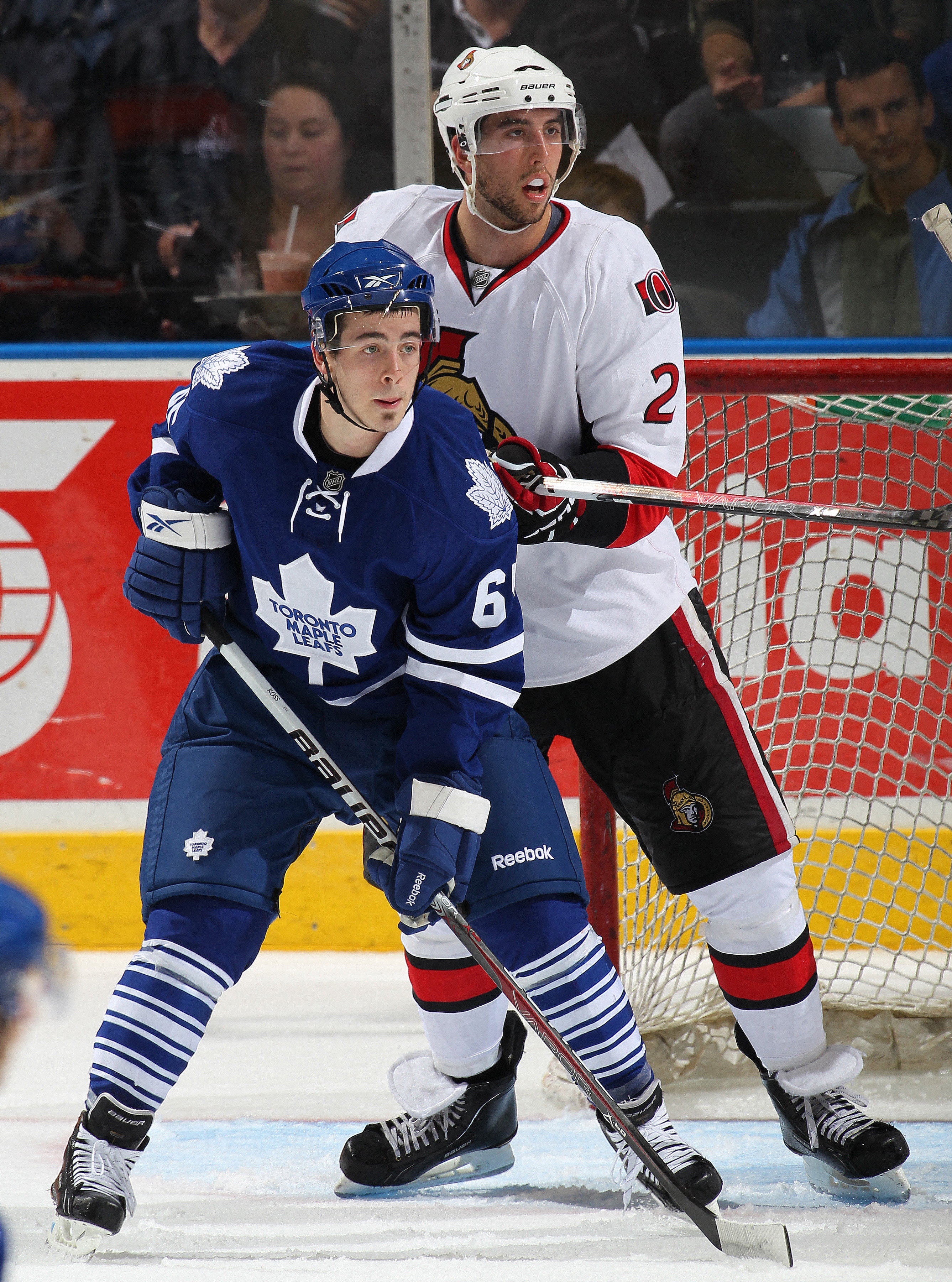 LONDON, CANADA - SEPTEMBER 14: Bradley Ross #65 of the Toronto Maple Leafs battles with Jared Cowen #2 of the Ottawa Senators in a game during the NHL Rookie Tournament on September 14, 2010 at the John Labatt Centre in London, Ontario, Canada. (Photo by