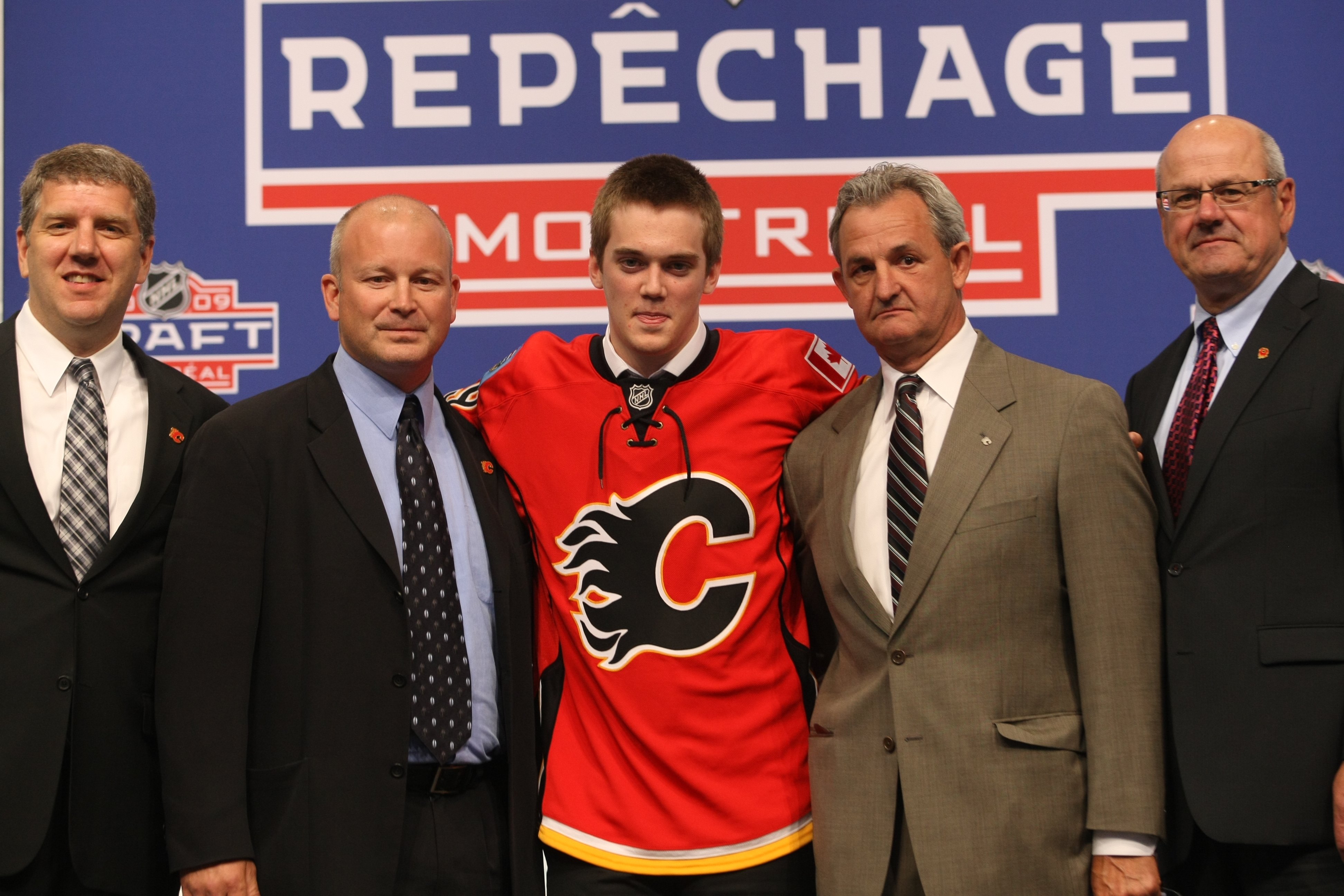 MONTREAL - JUNE 26: Calgary Flames Director of Scouting Tod Button, Scout Al Tuer, draft pick Tim Erixon, General Manager Darryl Sutter and President & CEO Ken King pose during the first round of the 2009 NHL Entry Draft at the Bell Centre on June 26, 20