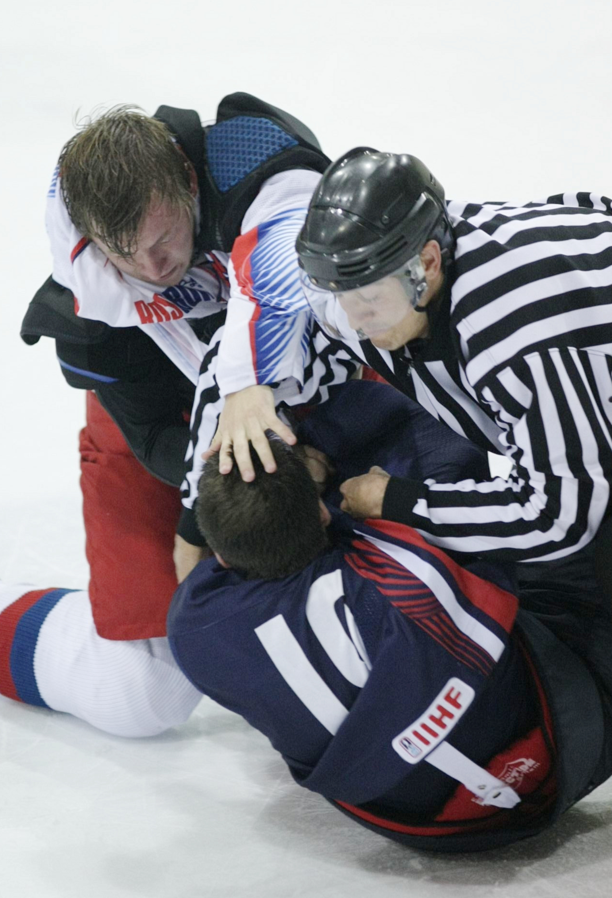 LAKE PLACID, NY - AUGUST 15: Jeremy Morin #19 of Team USA and Vladimir Tarasenko #9 of Team Russia fight during the second period of the Under-20 game at the 1980 Rink Herb Brooks Arena on August 15, 2009 in Lake Placid, New York. (Photo by Bruce Bennett