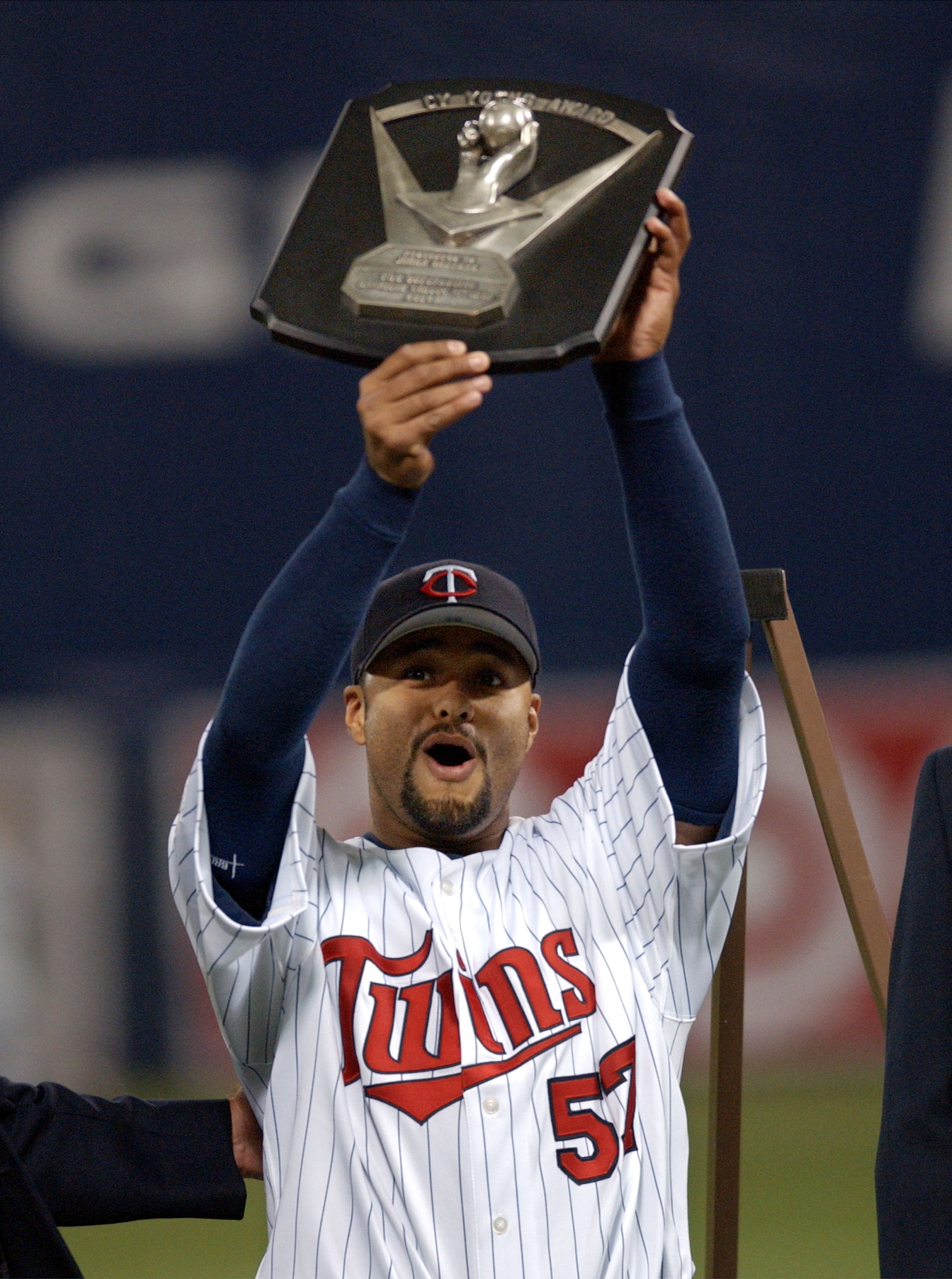 MINNEAPOLIS - APRIL 9:  Pitcher Johan Santana #57 of the Minnesota Twins holds his 2004 Cy Young trophy that was presented to him before the start of the Twins' American League game against the Chicago White Sox at the Metrodome April 9, 2005 in Minneapol