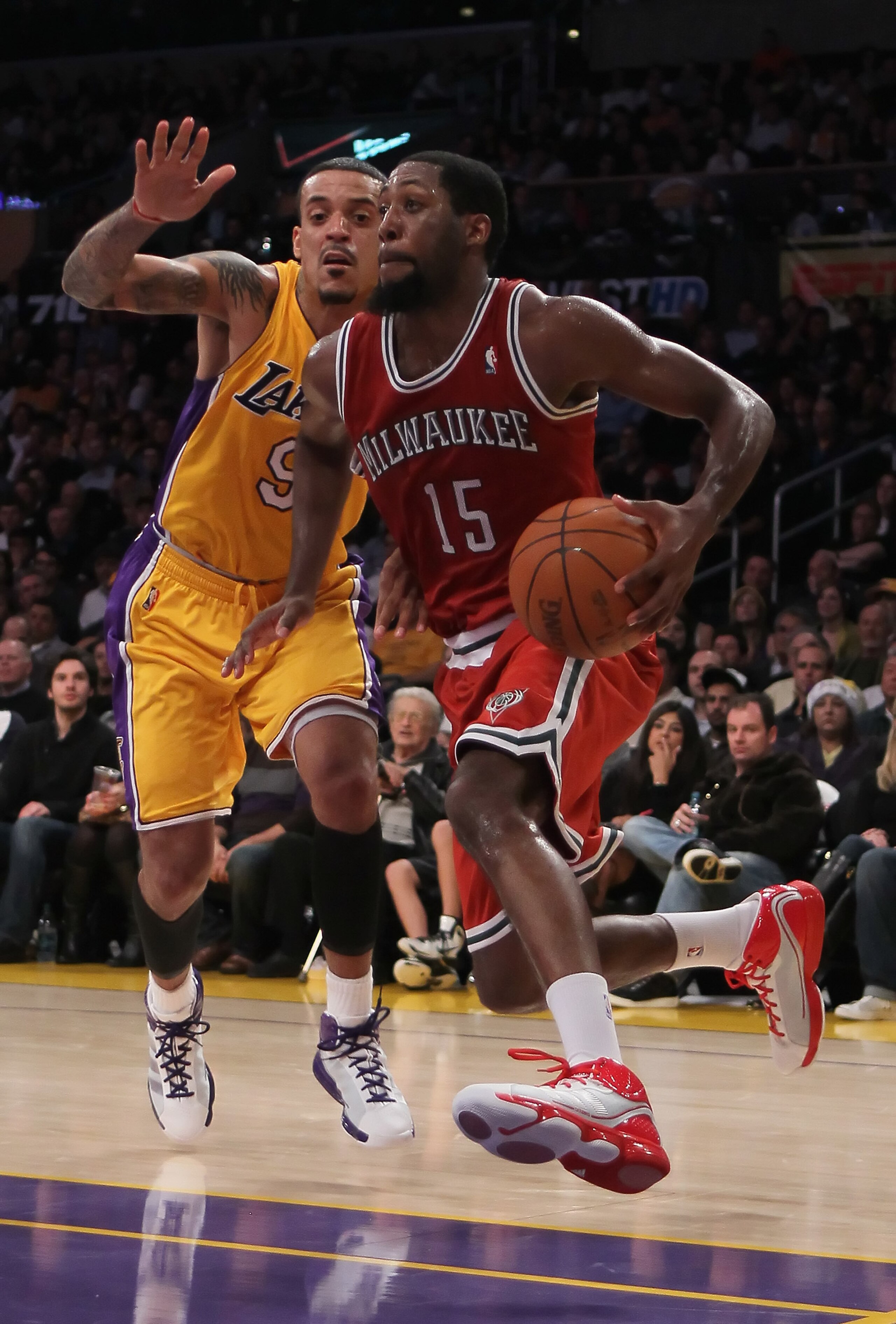 LOS ANGELES, CA - DECEMBER 21:  John Salmons #15 of the Milwaukee Bucks drives past Matt Barnes  #9 of the Los Angeles Lakers during the second half at Staples Center on December 21, 2010 in Los Angeles, California. The Bucks defeated the Lakers 98-79. NO