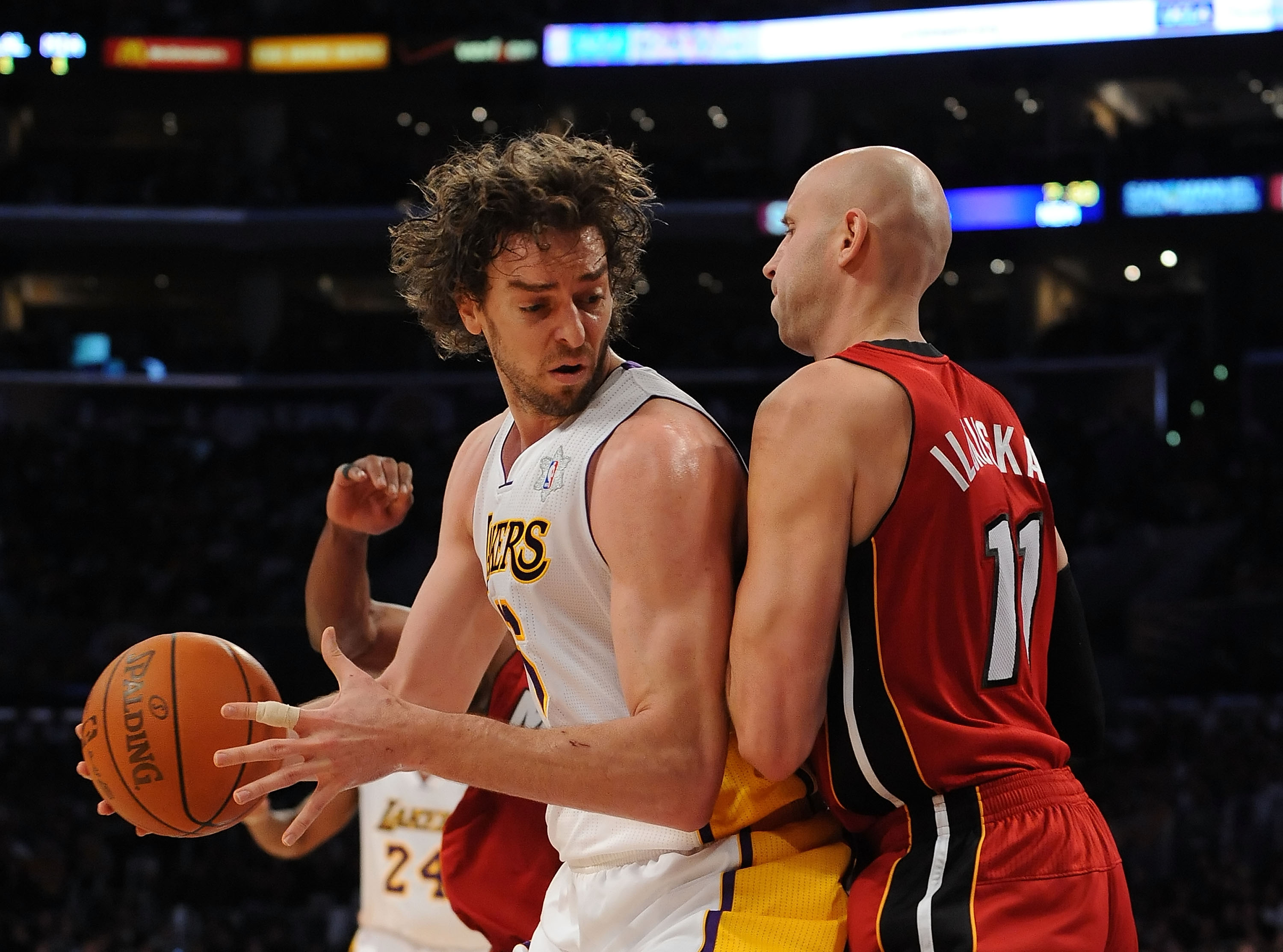 Miami Heat small forward LeBron James (6) keeps Los Angeles Lakers power  forward Pau Gasol (16) from getting the ball in the second half of their NBA  basketball game in Los Angeles