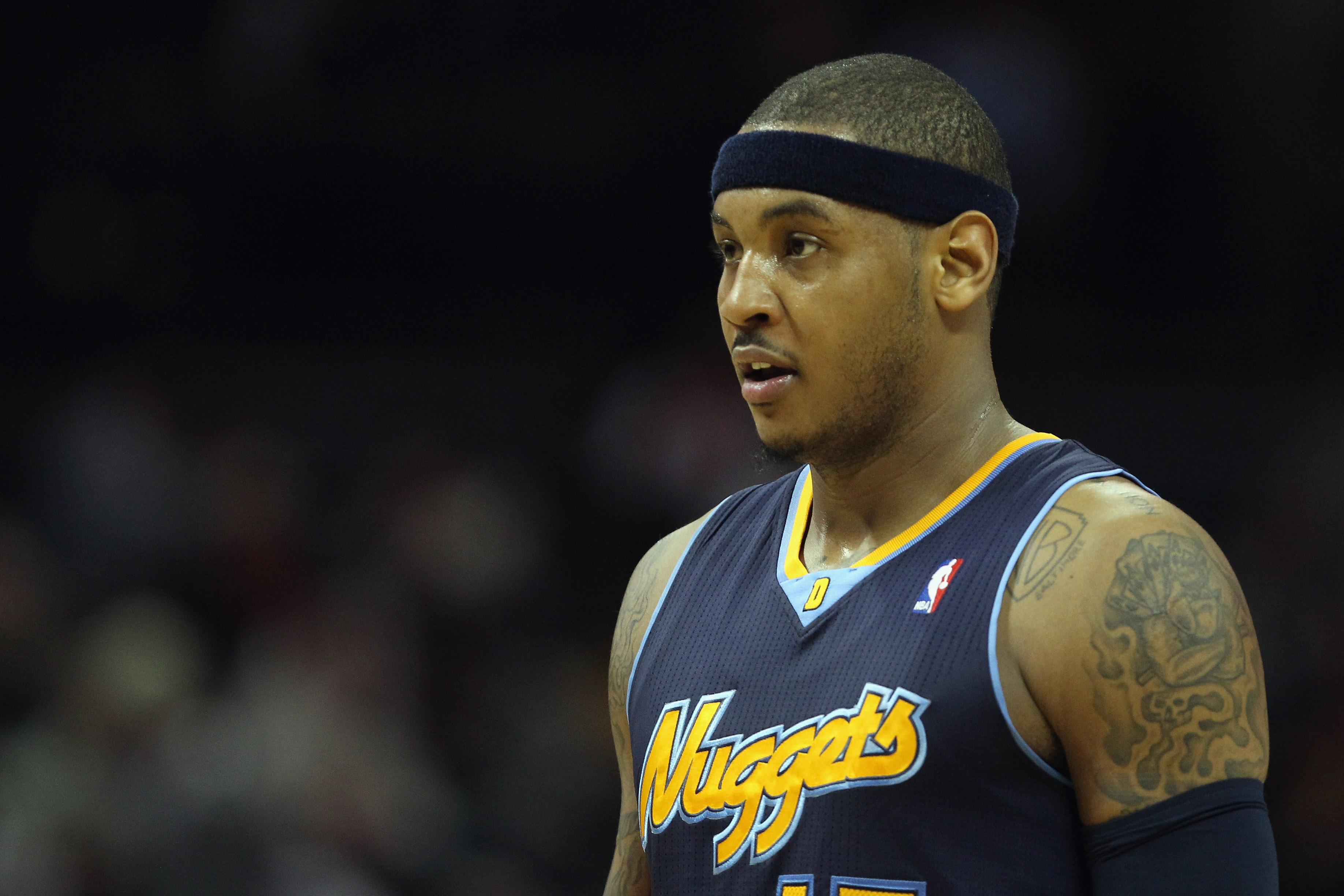CHARLOTTE, NC - DECEMBER 07:  Carmelo Anthony #15 of the Denver Nuggets watches on against the Charlotte Bobcats during their game at Time Warner Cable Arena on December 7, 2010 in Charlotte, North Carolina.  NOTE TO USER: User expressly acknowledges and