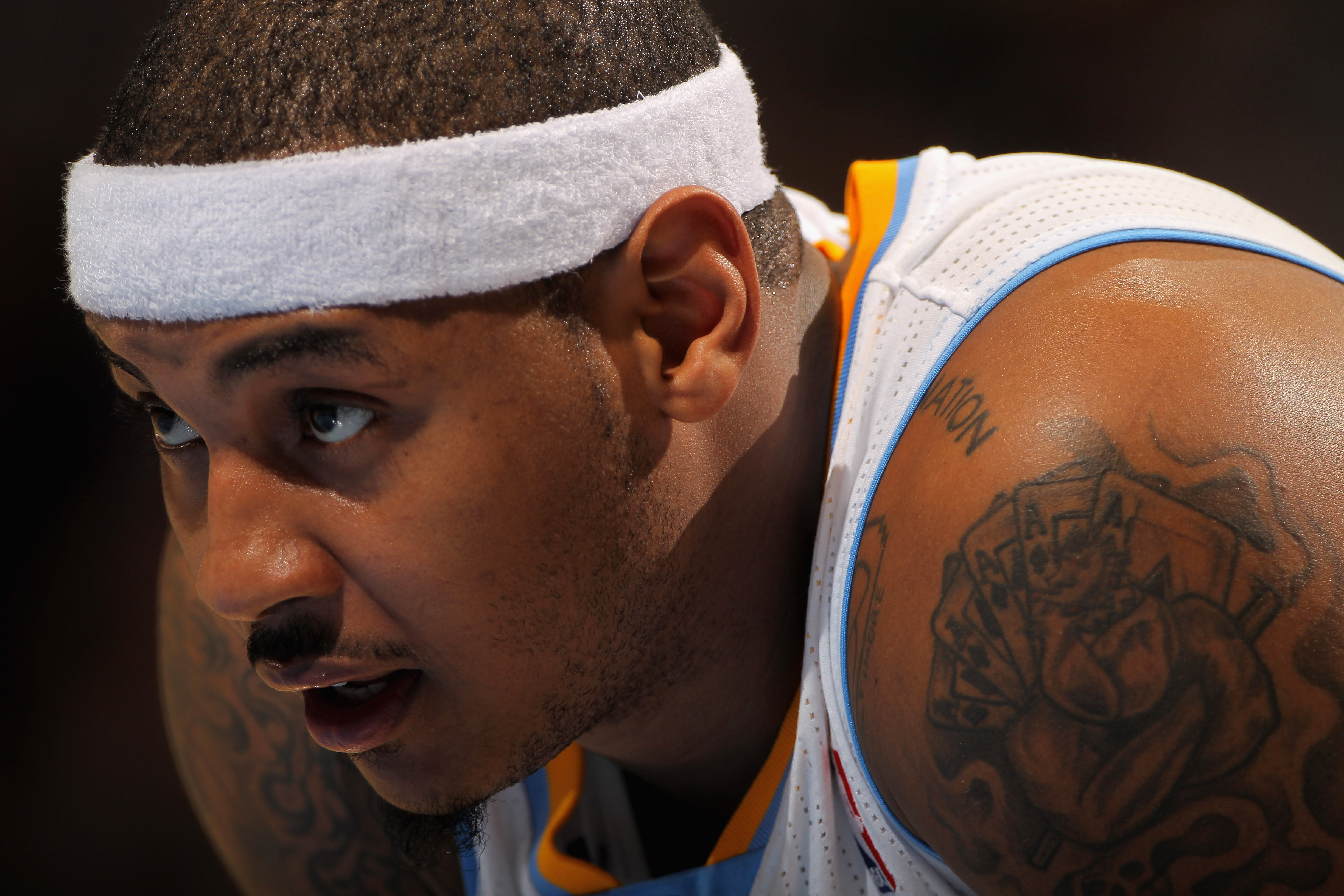 DENVER - NOVEMBER 16:  Carmelo Anthony #15 of the Denver Nuggets looks on during a break in the action against the New York Knicks at the Pepsi Center on November 16, 2010 in Denver, Colorado. The Nuggets defeated the Knicks 120-118. NOTE TO USER: User ex