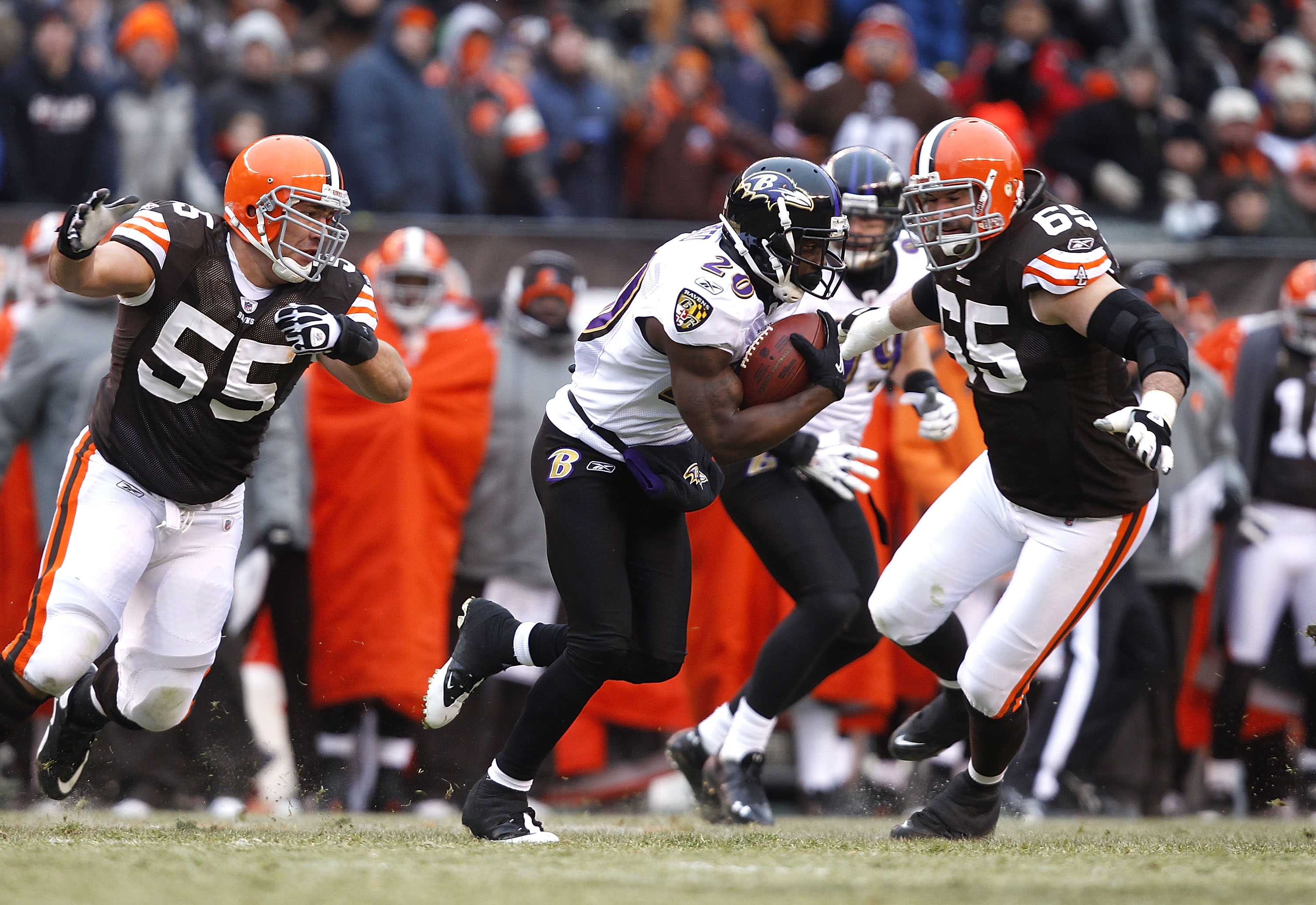 CLEVELAND - DECEMBER 26:  Safety Ed Reed #20 of the Baltimore Ravens returns an interception as he is chased by defenders Alex Mack #55 and Eric Steinbach #65 of the Cleveland Browns at Cleveland Browns Stadium on December 26, 2010 in Cleveland, Ohio.  (P