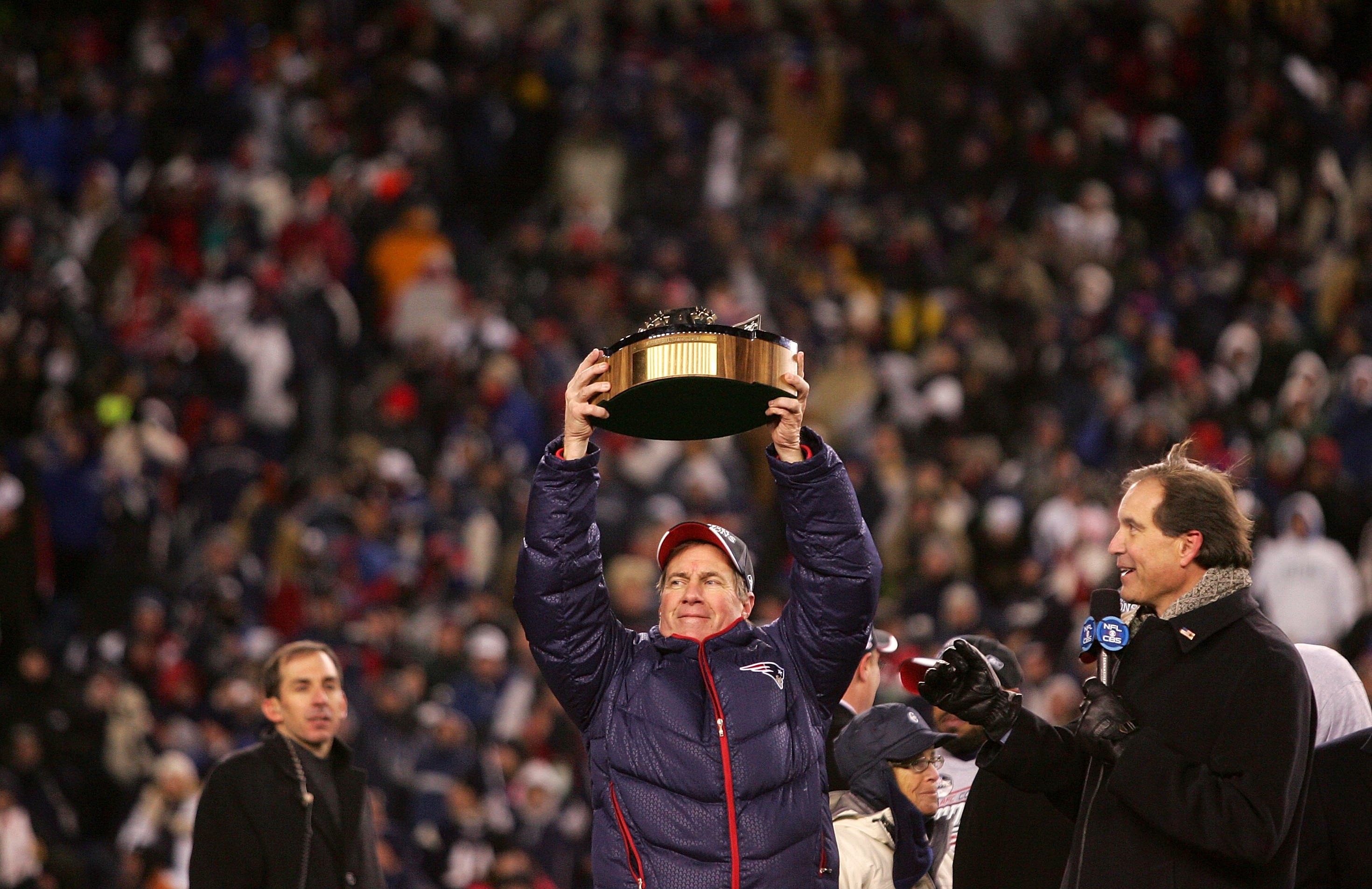 FOXBORO, MA - JANUARY 20:  Head coach Bill Belichick of the New England Patriots celebrates with the Lamar Hunt Trophy after the Patriots 21-12 win against the San Diego Chargers during the AFC Championship Game on January 20, 2008 at Gillette Stadium in