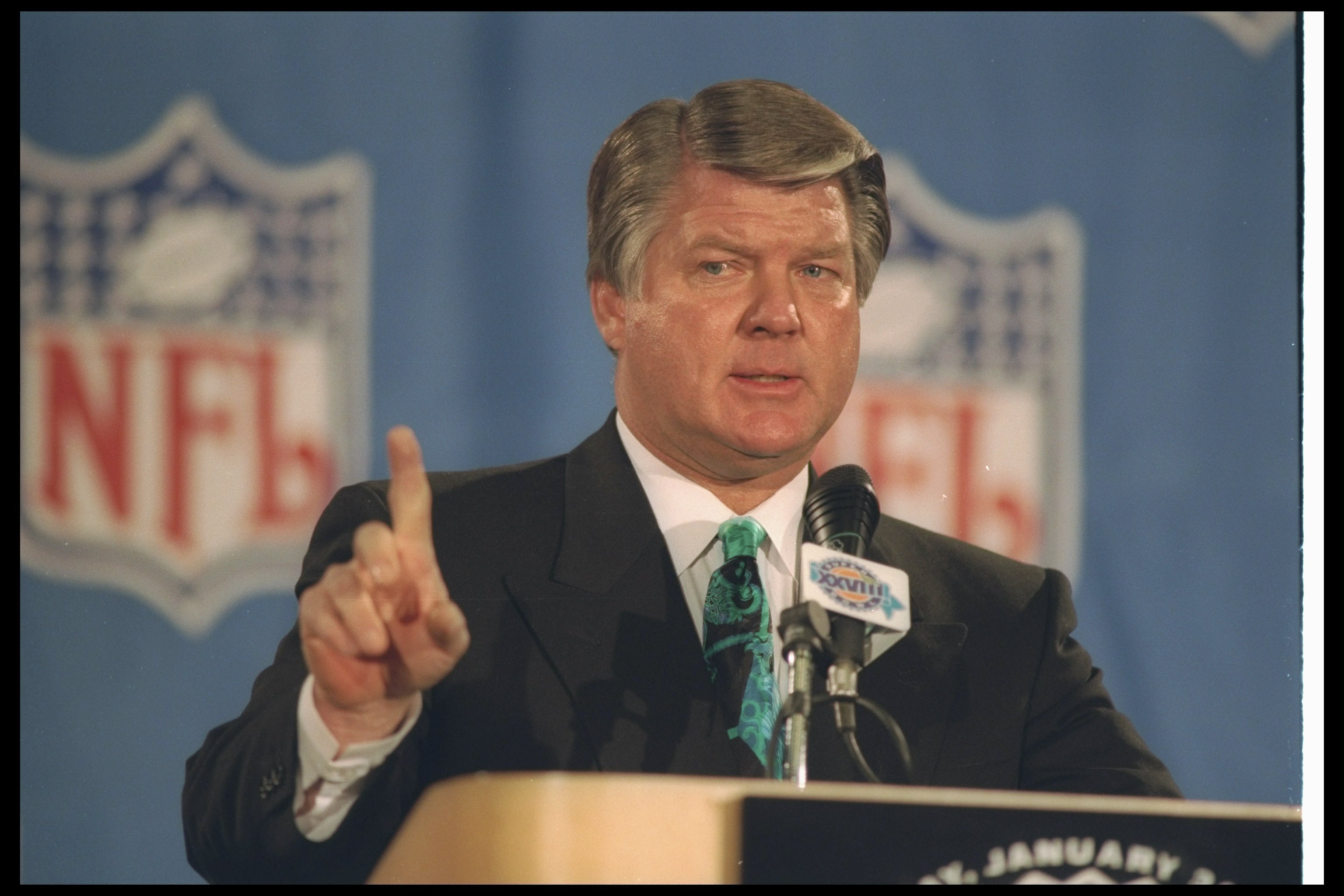 Head coach Jimmy Johnson of the Dallas Cowboys watches pregame