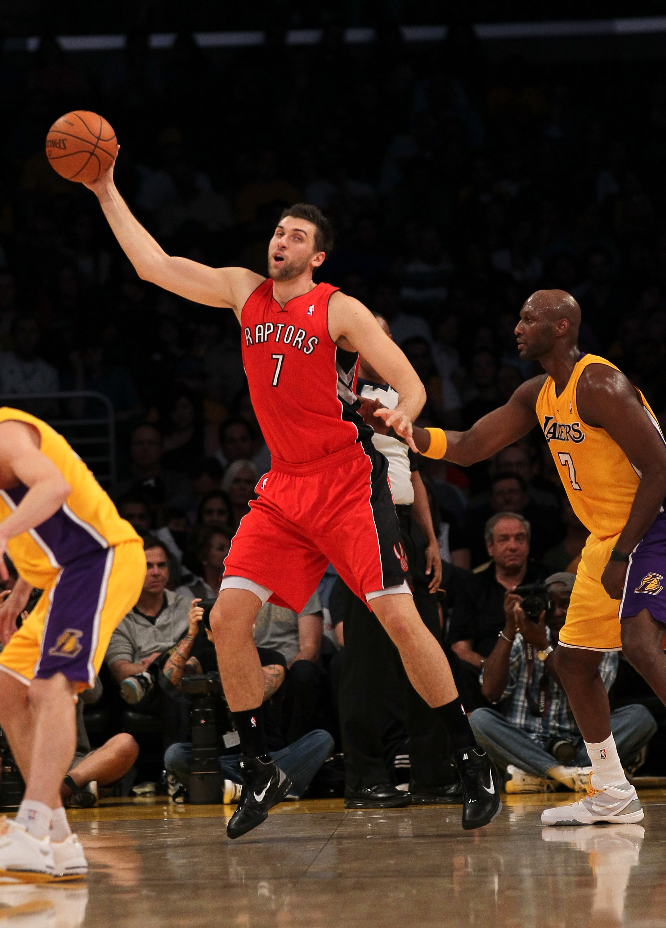 LOS ANGELES, CA - NOVEMBER 05:  Andrea Bargnani #1 of the Toronto Raptors controls the ball against Lamar Odom #7 of the Los Angeles Lakers at Staples Center on November 5, 2010 in Los Angeles, California.   NOTE TO USER: User expressly acknowledges and a