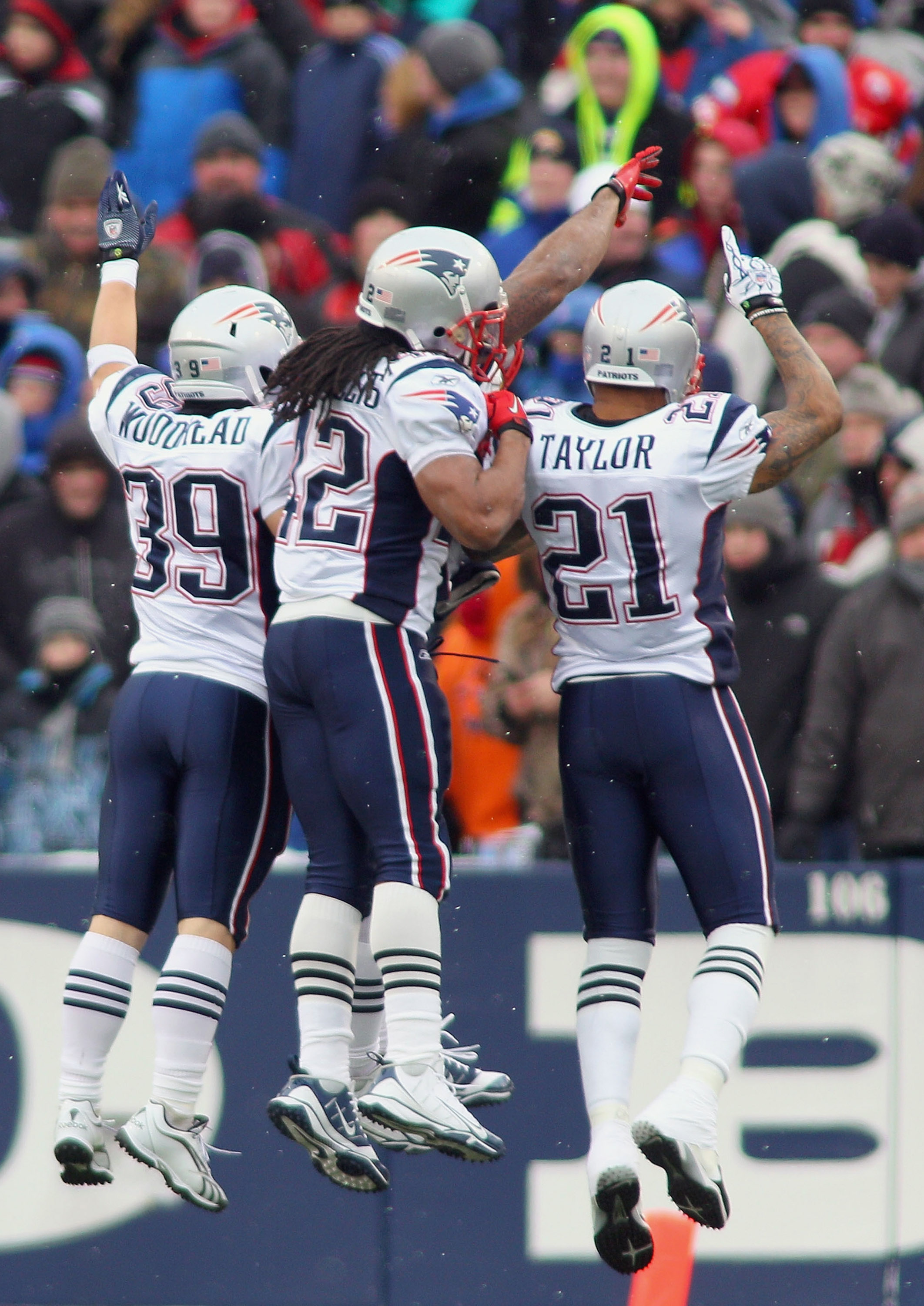 ORCHARD PARK, NY - DECEMBER 26: Danny Woodhead #39, Benjarvus Green-Ellis #42, and Fred Taylor #21  of the Patriots celebrate a touchdown in the first quarter against the Buffalo Bills at Ralph Wilson Stadium on December 26, 2010 in Orchard Park, New York
