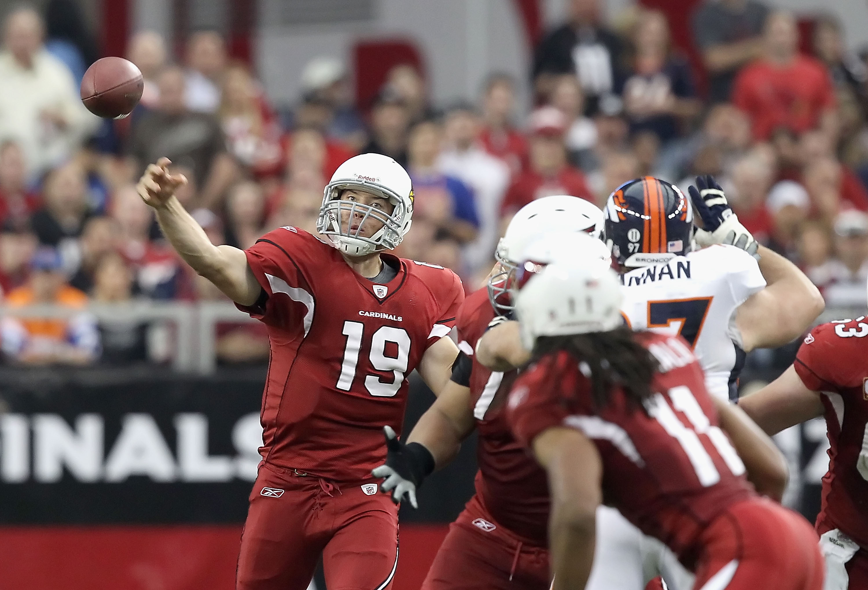 Arizona Cardinals quarterback John Skelton is pushed out of bounds