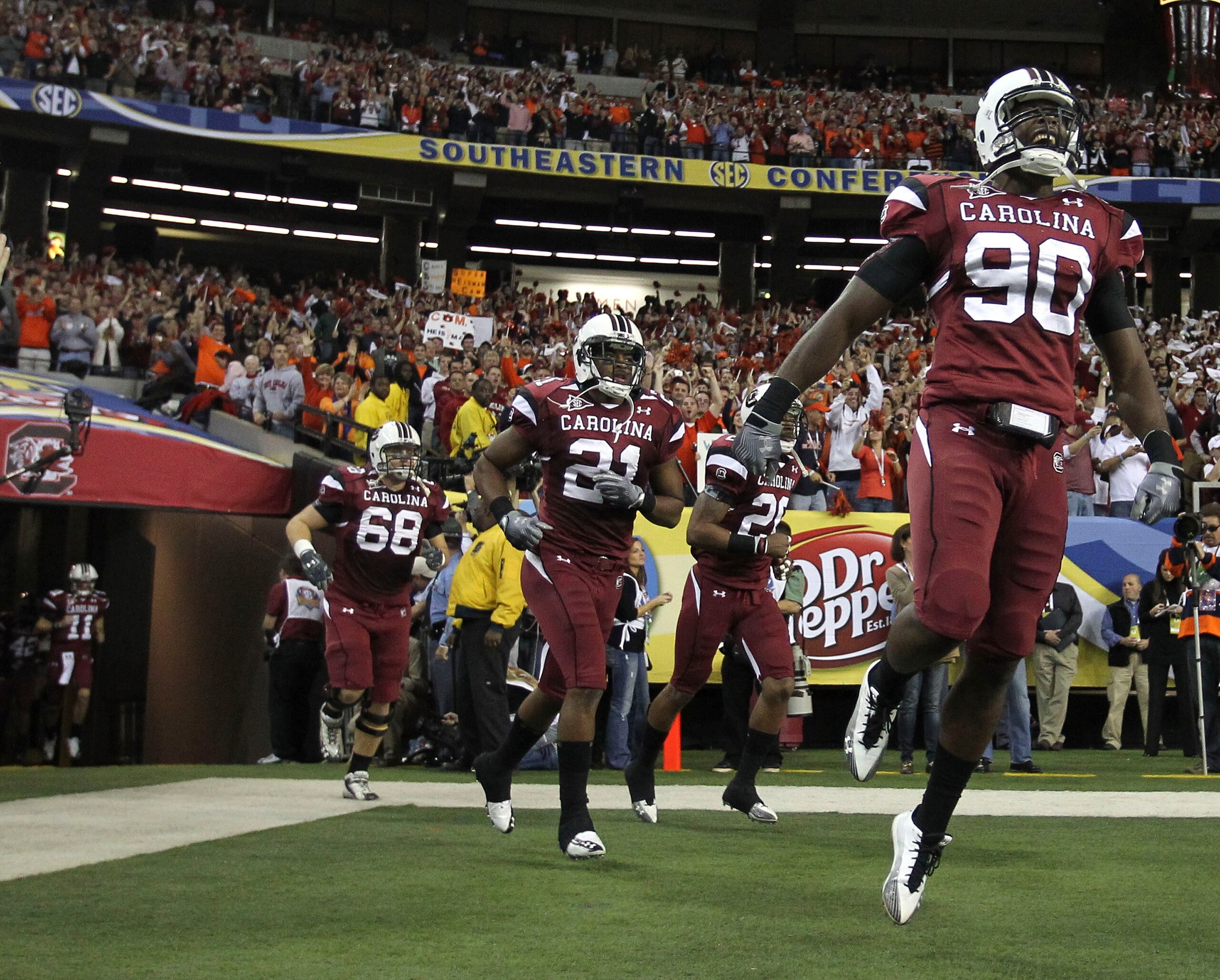 ATLANTA - DECEMBER 4:  Members of the South Carolina Gamecocks run out of the tunnel before the 2010 SEC Championship against the Auburn Tigers at Georgia Dome on December 4, 2010 in Atlanta, Georgia. (Photo by Mike Zarrilli/Getty Images)