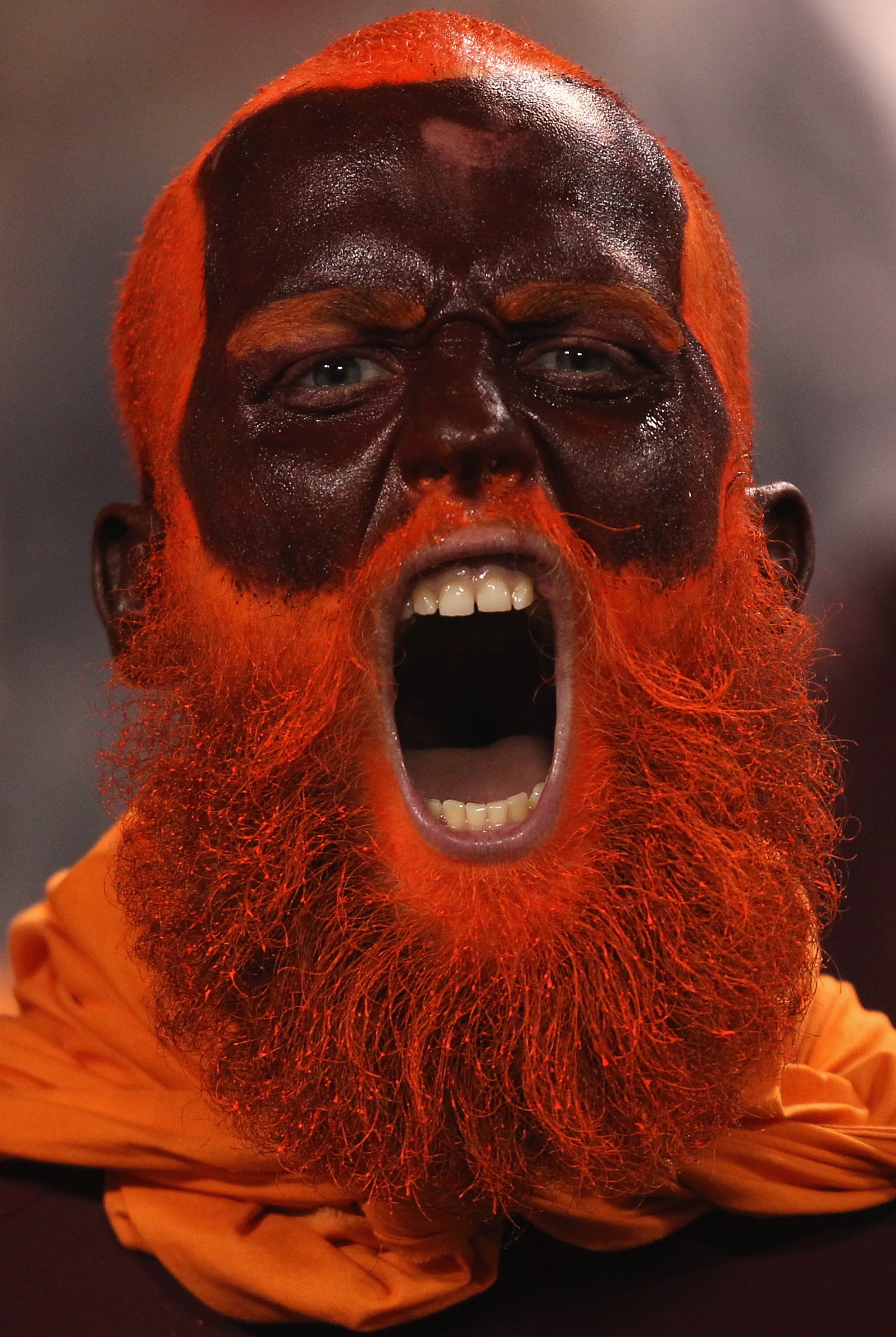 CHARLOTTE, NC - DECEMBER 04:  A fan of the Virginia Tech Hokies cheers on against the Florida State Seminoles during their game at Bank of America Stadium on December 4, 2010 in Charlotte, North Carolina.  (Photo by Streeter Lecka/Getty Images)