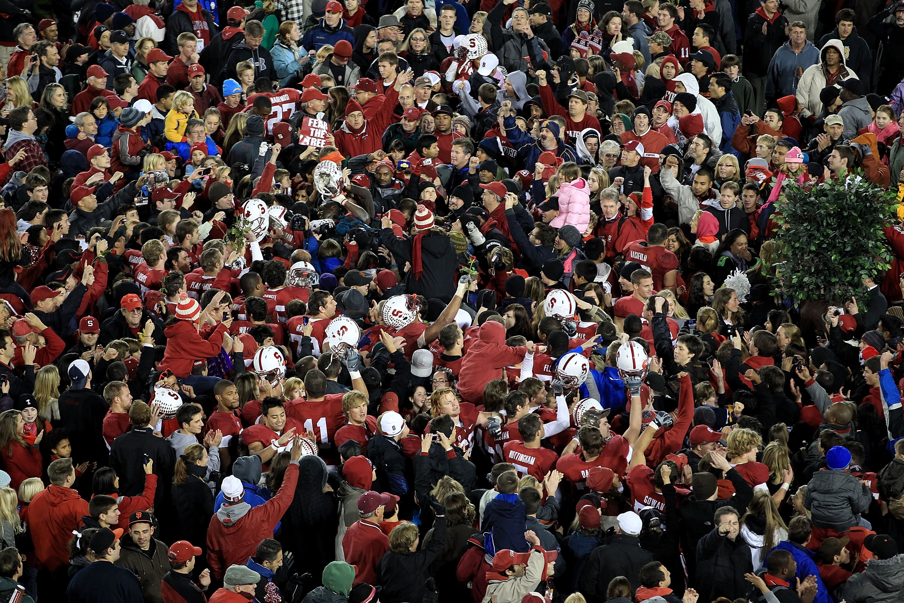 PALO ALTO, CA - NOVEMBER 27:  Fans of the Stanford Cardinal surround their team on the field after they beat the Oregon State Beavers at Stanford Stadium on November 27, 2010 in Palo Alto, California.  (Photo by Ezra Shaw/Getty Images)