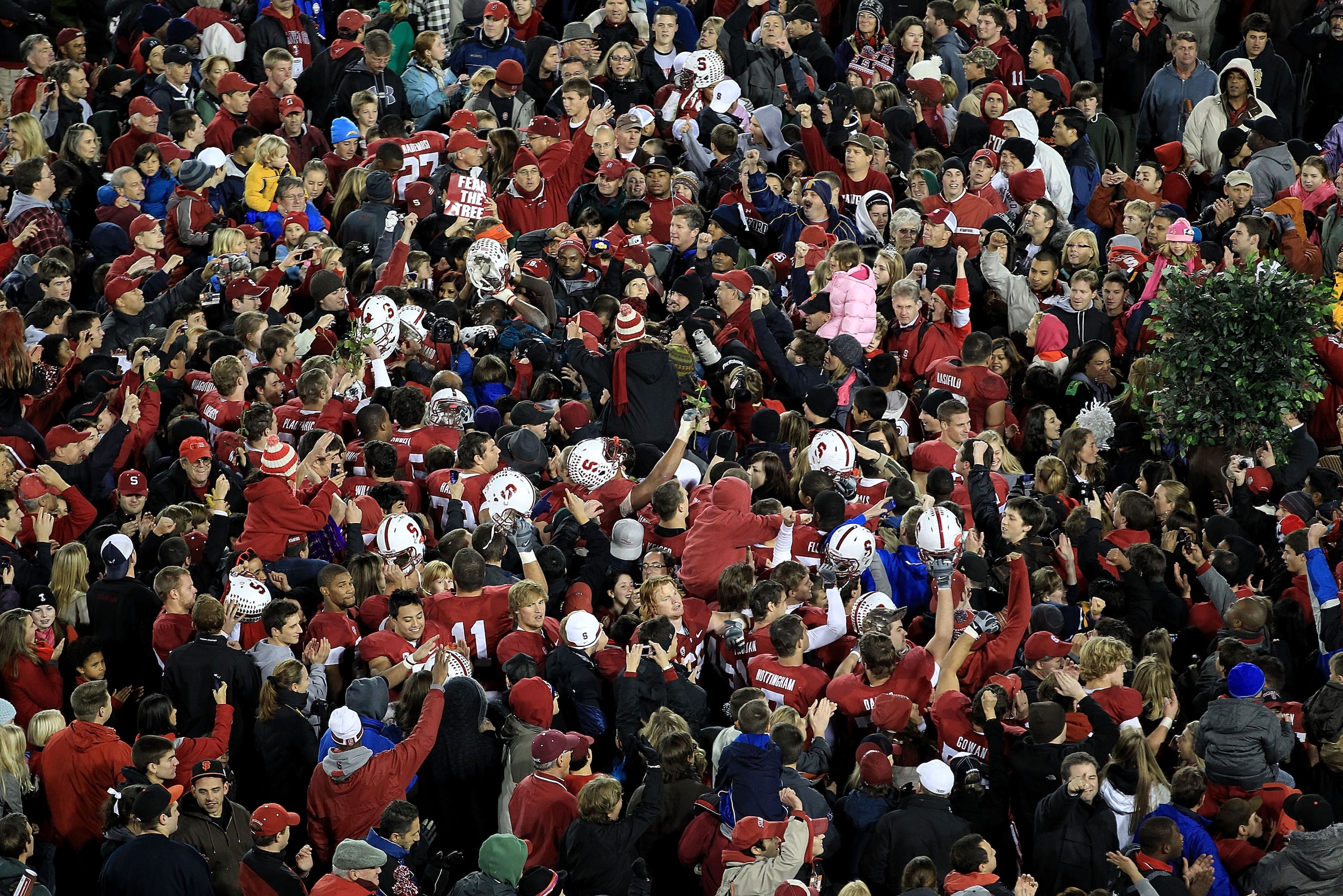 PALO ALTO, CA - NOVEMBER 27:  Fans of the Stanford Cardinal surround their team on the field after they beat the Oregon State Beavers at Stanford Stadium on November 27, 2010 in Palo Alto, California.  (Photo by Ezra Shaw/Getty Images)