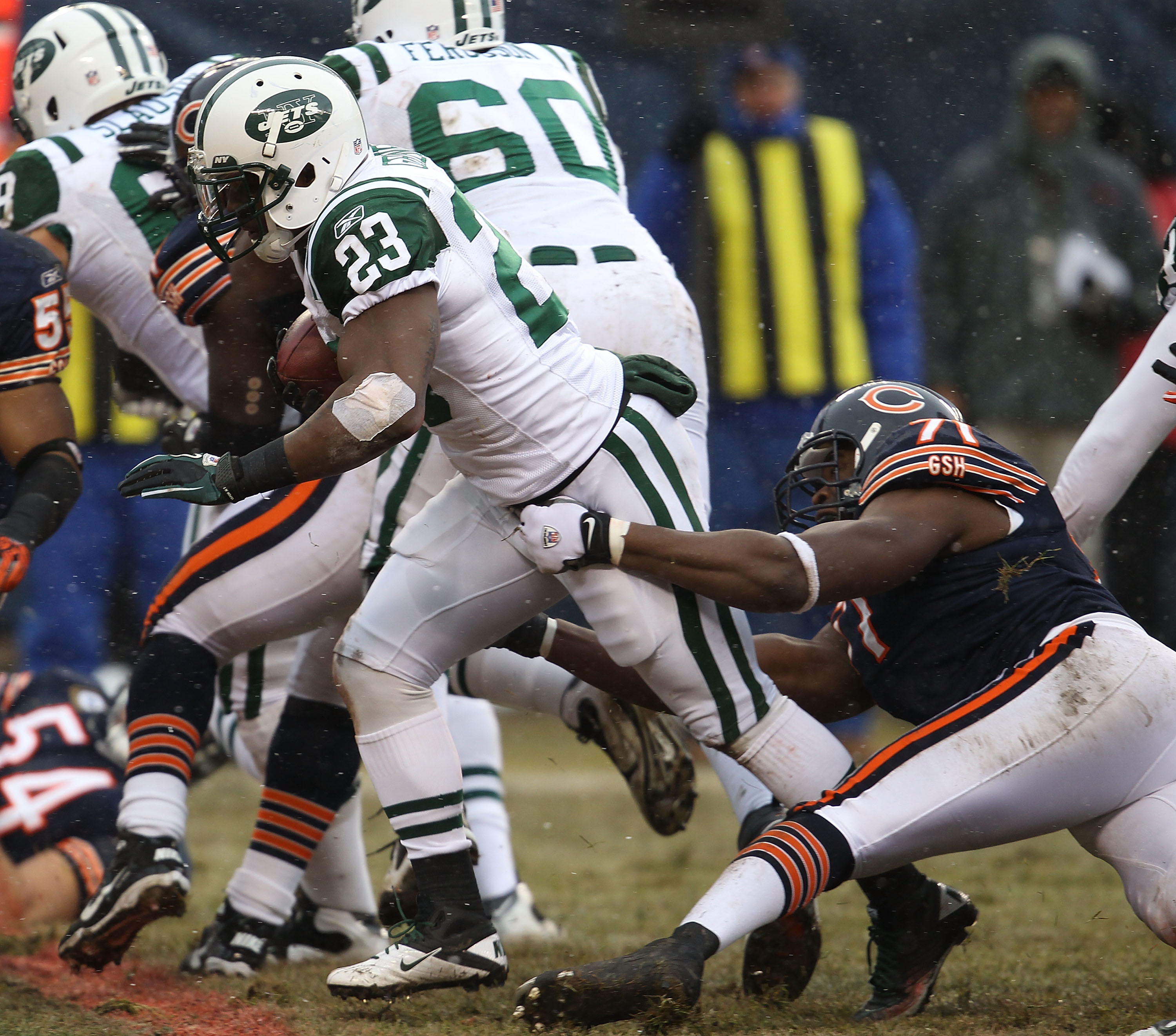 CHICAGO, IL - DECEMBER 26: Shonn Greene #23 of the New York Jets breaks away from Israel Idonije #71 of the Chicago Bears as he runs for a touchdown against the Chicago Bears at Soldier Field on December 26, 2010 in Chicago, Illinois. The Bears defeated t