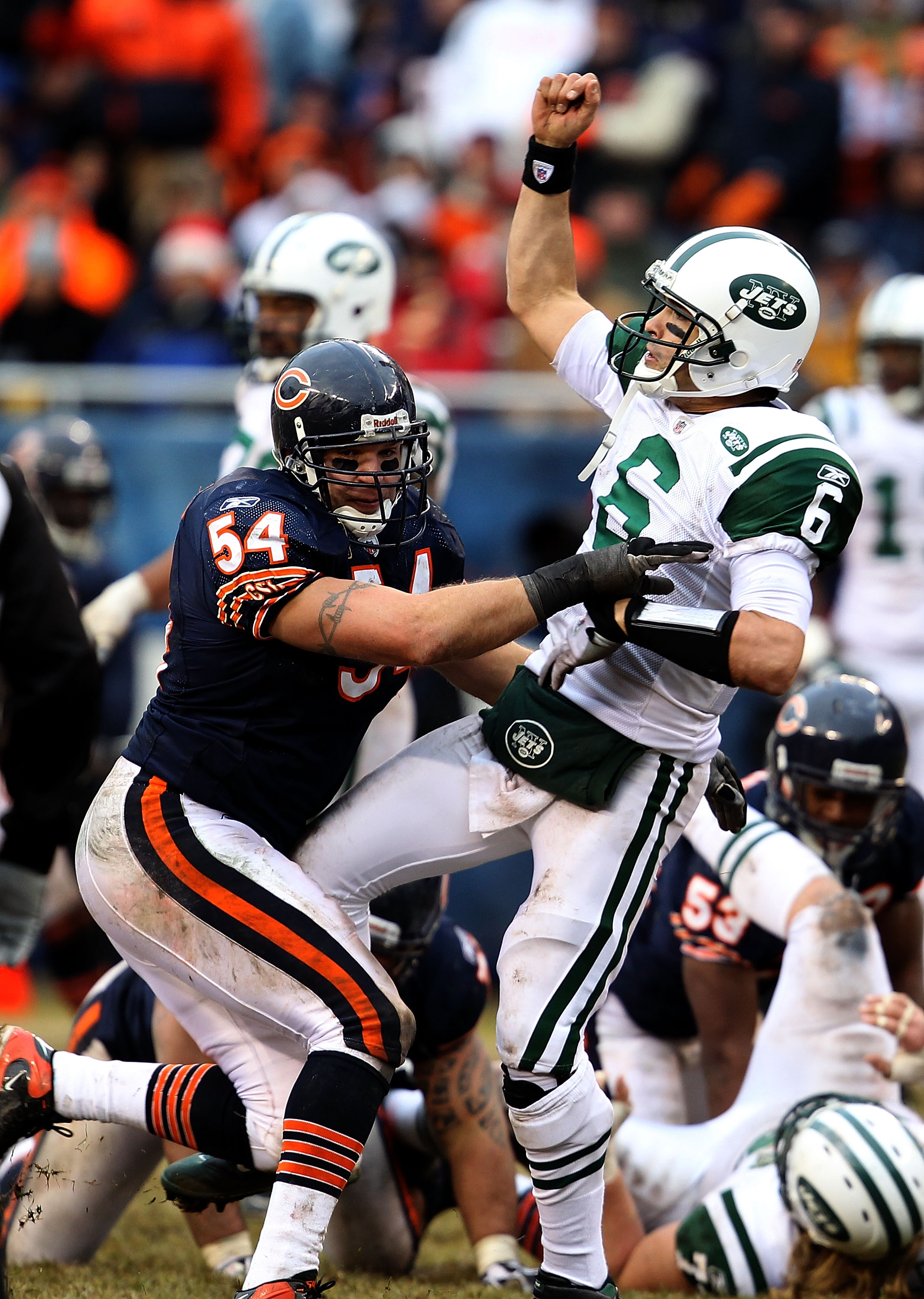 CHICAGO, IL - DECEMBER 26: Brian Urlacher #54 of the Chicago Bears hits Mark Sanchez #6 of the New York Jets at Soldier Field on December 26, 2010 in Chicago, Illinois. The Bears defeated the Jets 38-34.  (Photo by Jonathan Daniel/Getty Images)