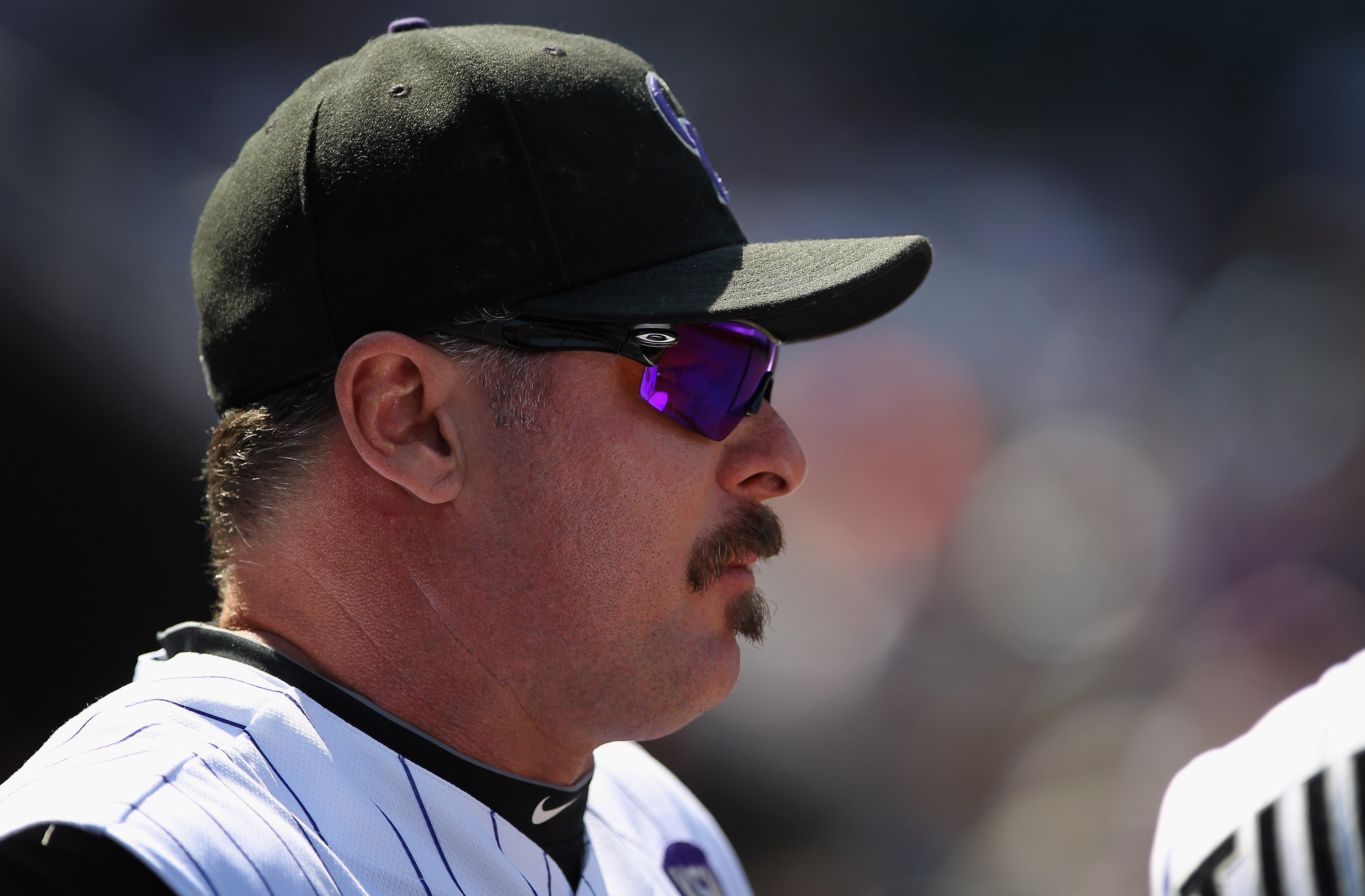 DENVER - SEPTEMBER 15:  Jason Giambi #23 of the Colorado Rockies looks on from the dugout against the San Diego Padres at Coors Field on September 15, 2010 in Denver, Colorado. The Rockies defeated the Padres 9-6.  (Photo by Doug Pensinger/Getty Images)