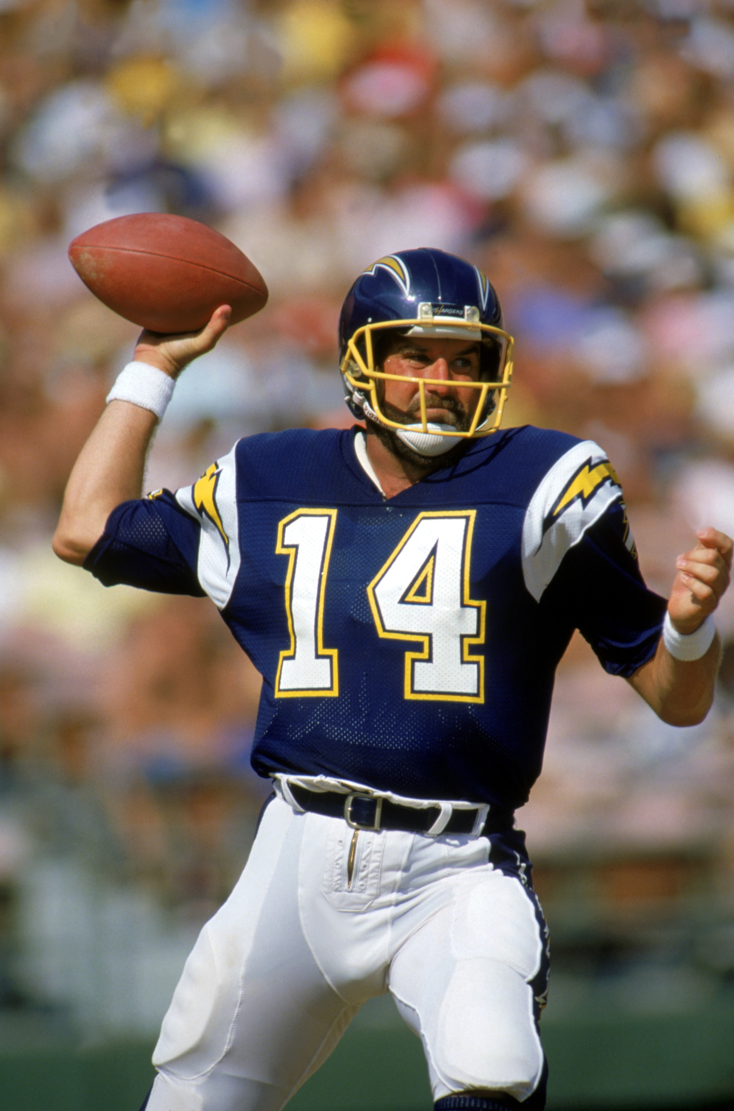 SAN DIEGO, CA - 1987:  Quarterback Dan Fouts #14 of the San Diego Chargers looks to pass during a game against the Arizona Cardinals at Jack Murphy Stadium during the 1987 NFL season in San Diego, California.  (Photo by Mike Powell/Getty Images)