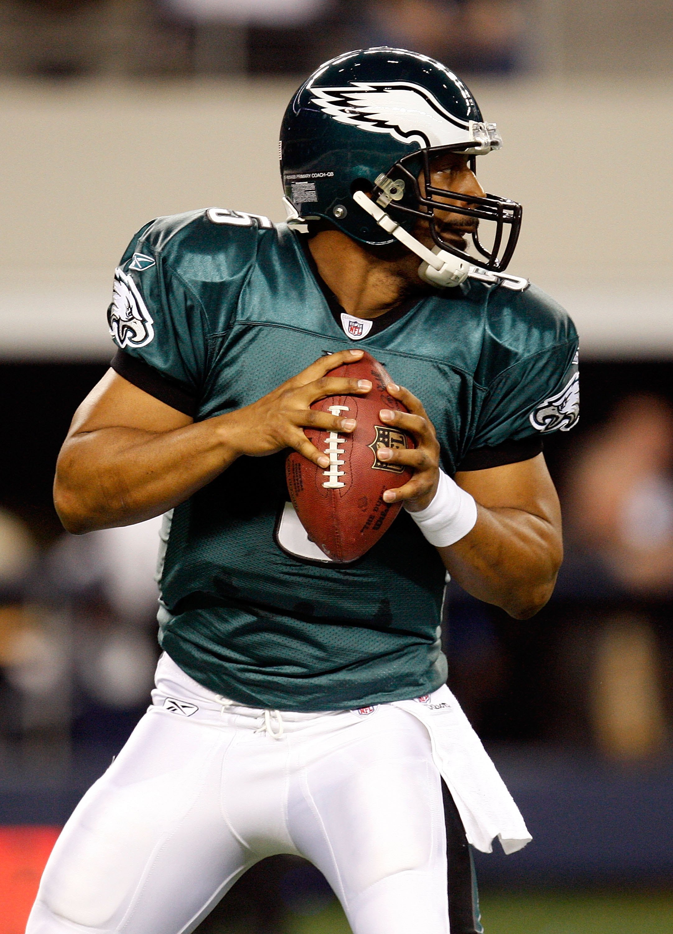 Philadelphia Eagles quarterback Donovan McNabb adjusts his wool cap while  wearing heavy gloves as he tries to keep warm on the sidelines during  second quarter against the Buffalo Bills in Philadelphia at