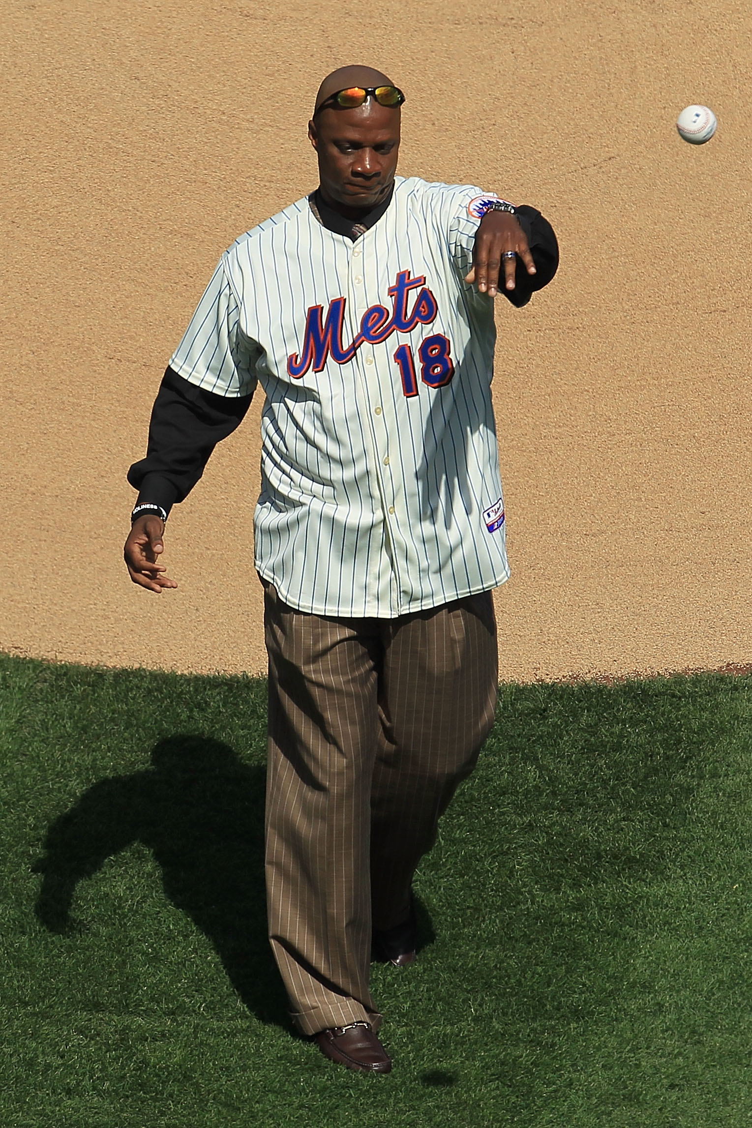 NEW YORK - APRIL 05: Former New York Mets player, Darryl Strawberry throws out the ceremonial first pitch prior to the game between the New York Mets and the Florida Marlins during their Opening Day game at Citi Field on April 5, 2010 in the Flushing neig