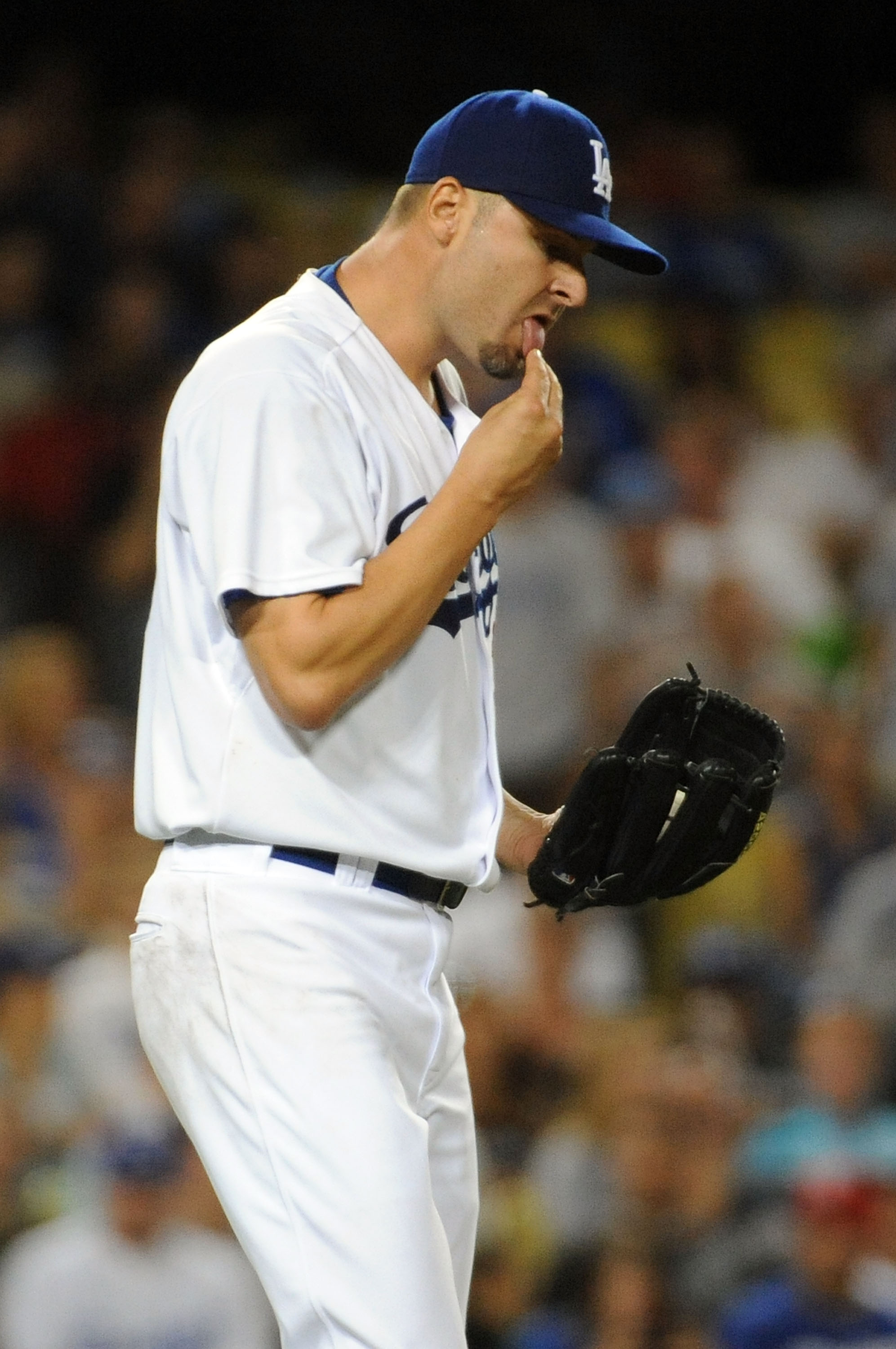LOS ANGELES, CA - AUGUST 5: Jason Schmidt #29 of the Los Angeles Dodgers reacts after hitting Craig Counsell #30 of the Milwaukee Brewers in the fourth inning at Dodger Stadium August 5, 2009 in Los Angeles, California.  (Photo by Harry How/Getty Images)