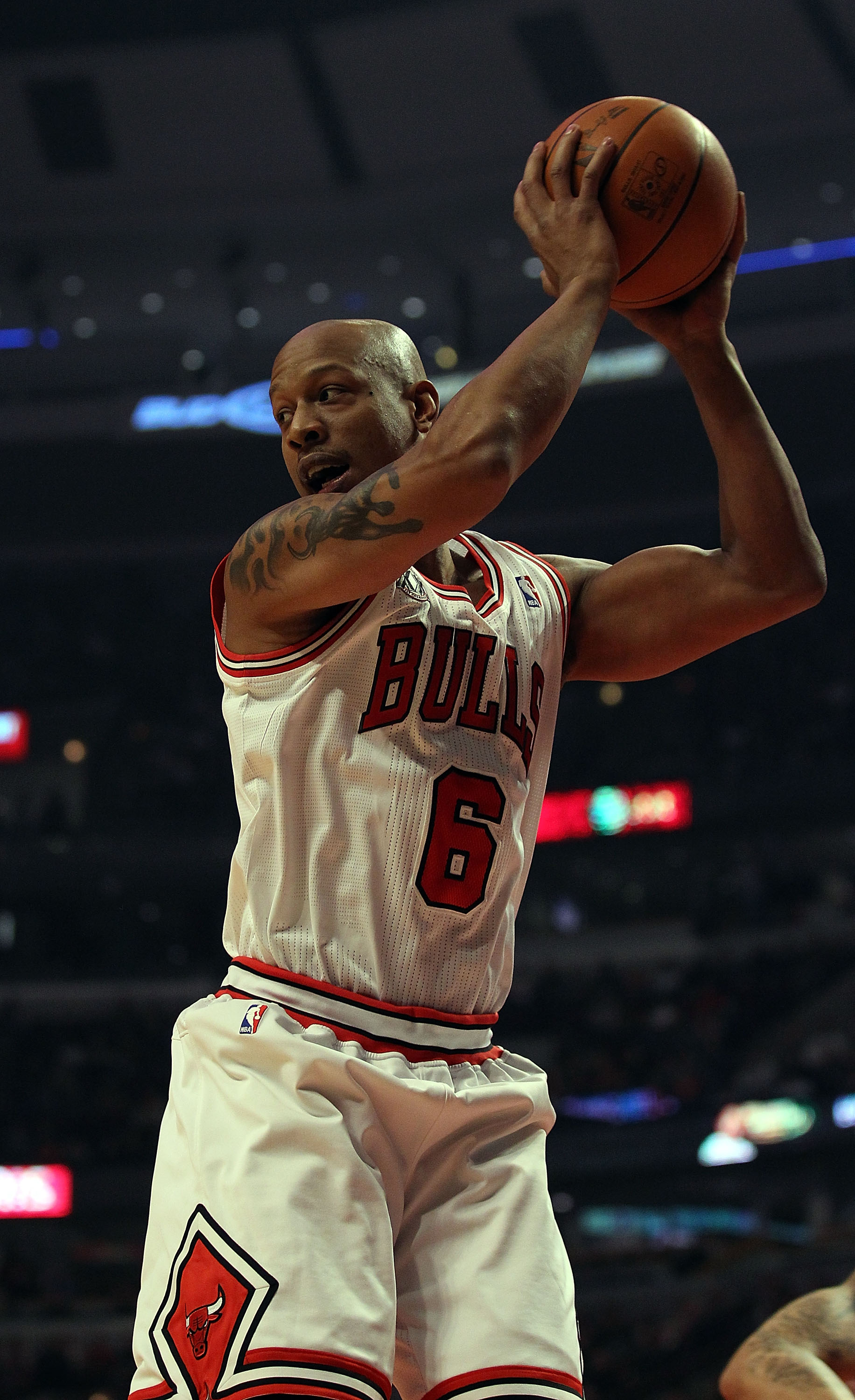 CHICAGO, IL - DECEMBER 21: Keith Bogans #6 of the Chicago Bulls grabs a rebound against the Philadelphia 76ers at the United Center on December 21, 2010 in Chicago, Illinois. The Bulls defeated the 76ers 121-76. NOTE TO USER: User expressly acknowledges a