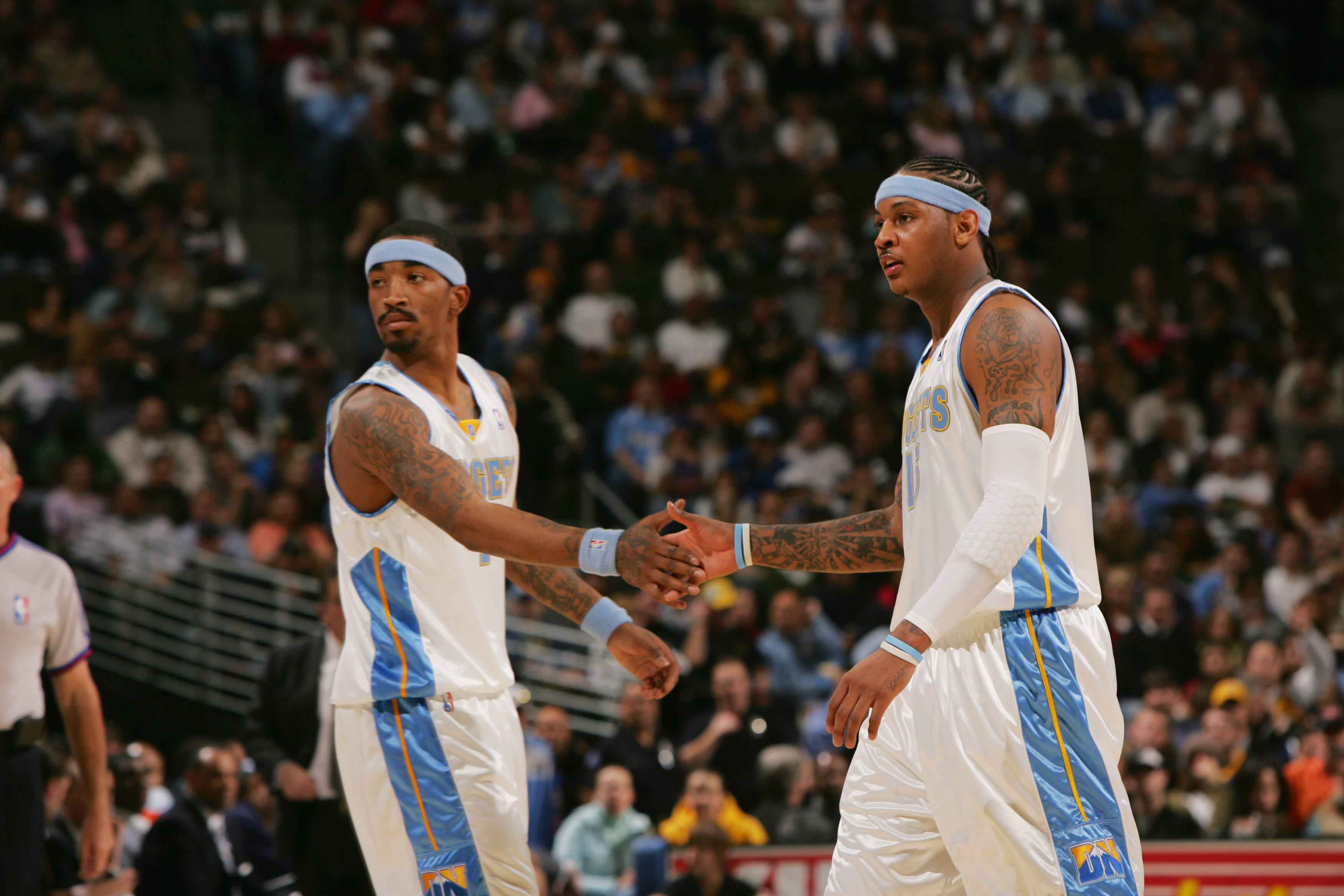 DENVER - JANUARY 22:  J.R. Smith #1 and Carmelo Anthony #15 of the Denver Nuggets celebrate a play during the NBA game against the Memphis Grizzlies at the Pepsi Center on January 22, 2007 in Denver, Colorado. The Nuggets won 98-115, in Anthony's debut ga