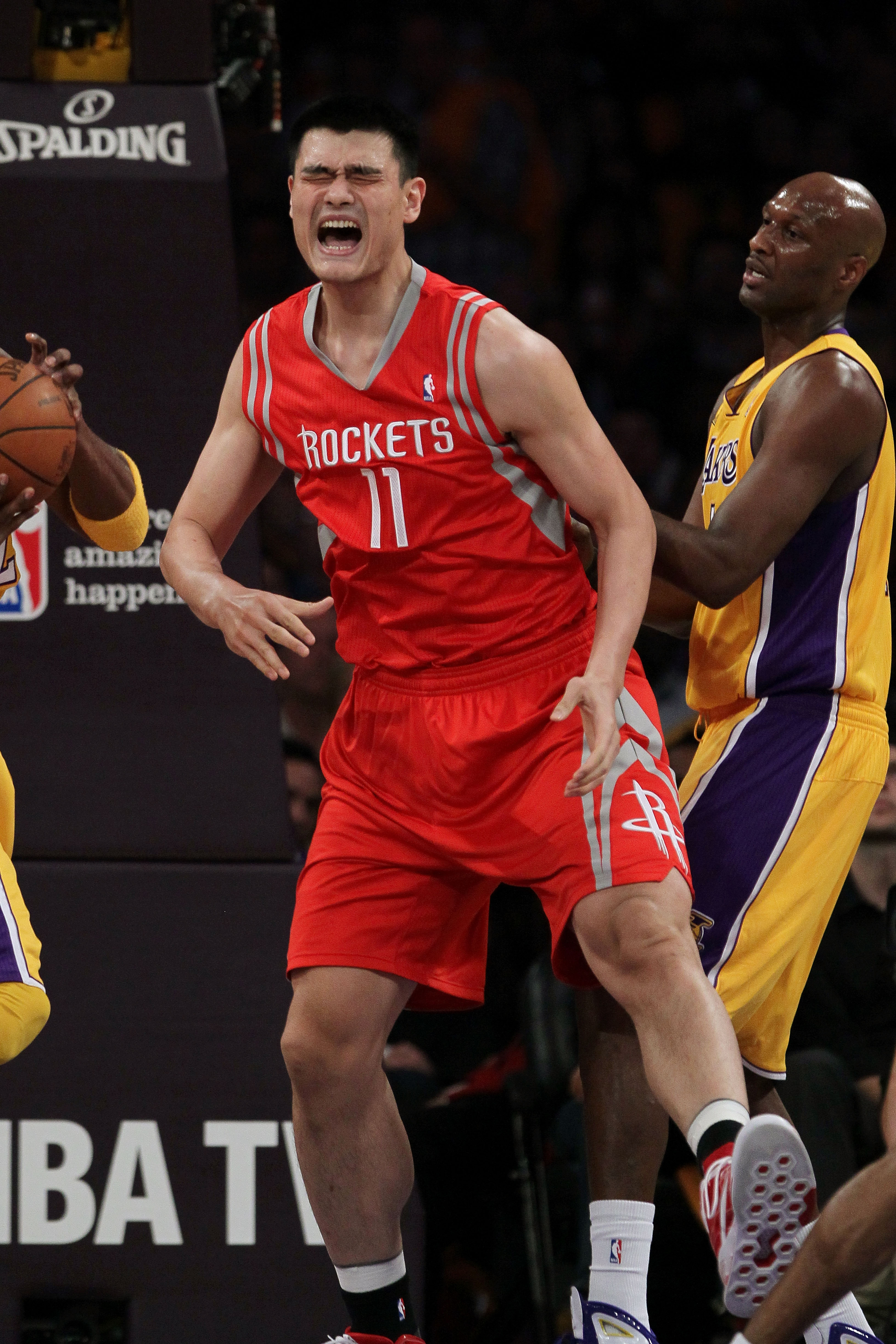 LOS ANGELES, CA - OCTOBER 26:  Yao Ming #11 of the Houston Rockets reacts to a play during their opening night game against the Los Angeles Lakers at Staples Center on October 26, 2010 in Los Angeles, California. NOTE TO USER: User expressly acknowledges