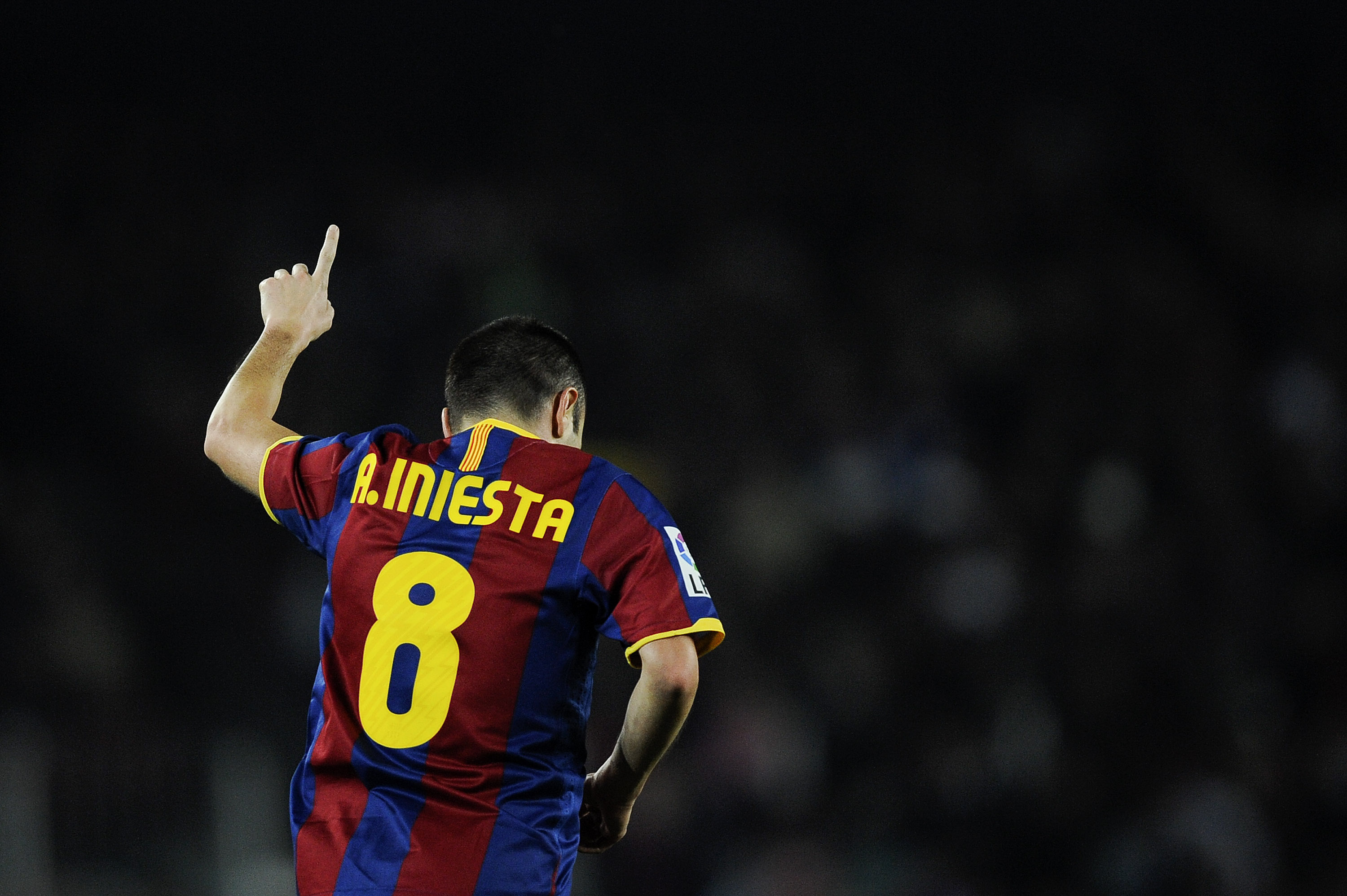 BARCELONA, SPAIN - DECEMBER 12:  Andres Iniesta of Barcelona celebrates after scoring his goal during the La Liga match between Barcelona and Real Sociedad at Camp Nou Stadium on December 12, 2010 in Barcelona, Spain. Barcelona won 5-0.  (Photo by David R