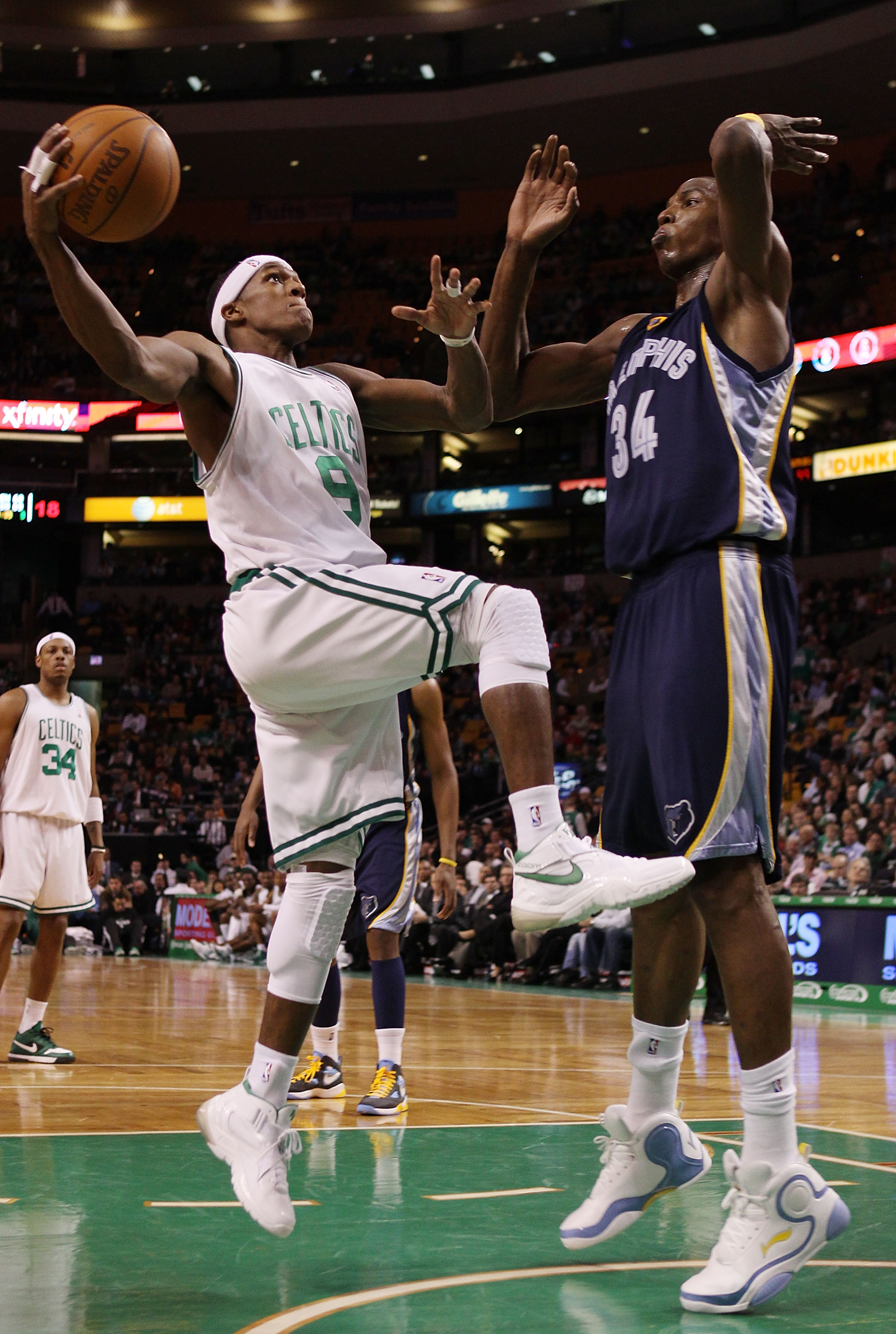 BOSTON - MARCH 10:  Rajon Rondo #9  of the Boston Celtics heads for the net as Hasheem Thabeet #34 of the Memphis Grizzlies defends on March 10, 2010 at the TD Garden in Boston, Massachusetts. The Grizzlies defeated the Celtics 111-91. NOTE TO USER: User