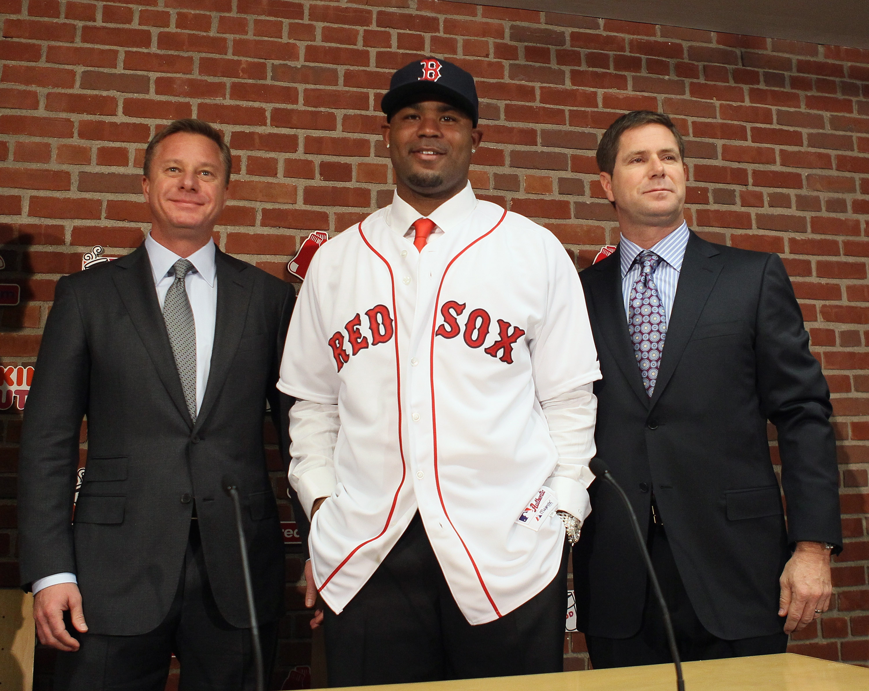 BOSTON, MA - DECEMBER 11:  Carl Crawford poses with his agents during a press conference announcing his signing with the Boston Red Sox on December 11,  2010 at the Fenway Park in Boston, Massachusetts.  (Photo by Elsa/Getty Images)