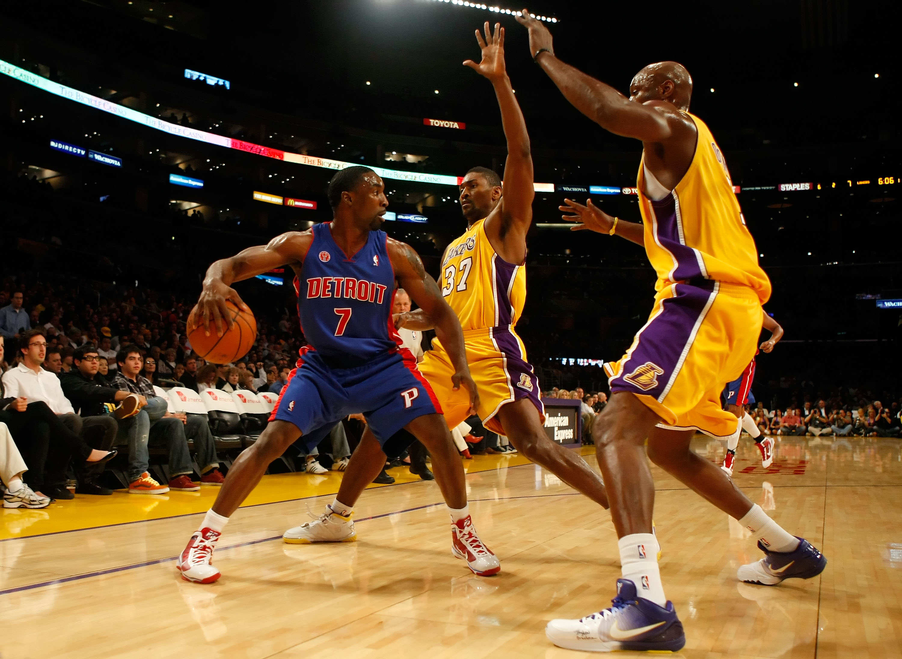 LOS ANGELES, CA - NOVEMBER 17:  Ben Gordon #7 of the Detroit Pistons is defended by Ron Artest #37 and Lamar Odom #7 of the Los Angeles Lakers in the first half at Staples Center on November 17, 2009 in Los Angeles, California. NOTE TO USER: User expressl