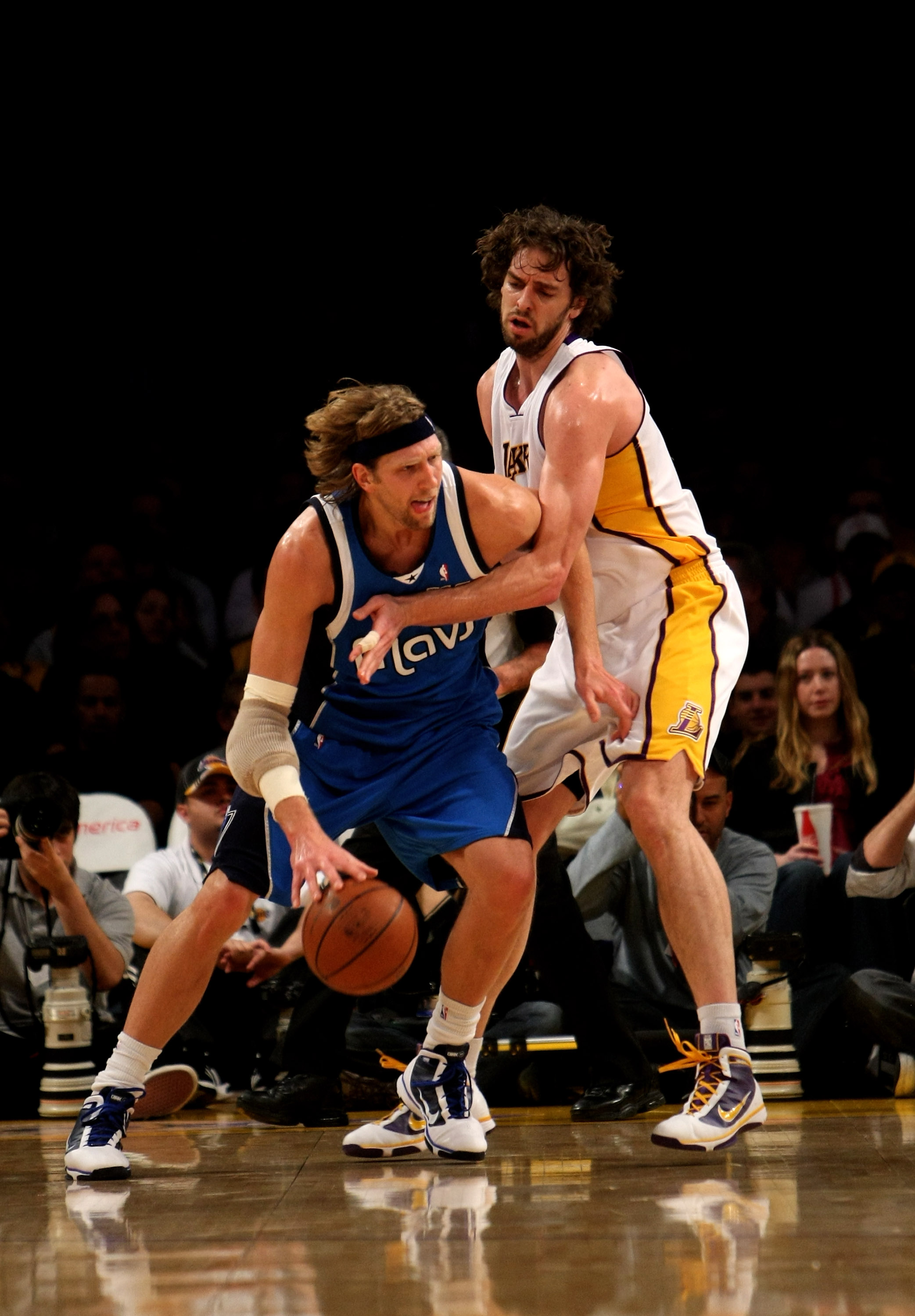 LOS ANGELES, CA - JANUARY 03: Dirk Nowitzki #41 of the Dallas Mavericks driveas against Pau Gasol #16 of the Los Angeles Lakers on January 3, 2010 at Staples Center in Los Angeles, California. NOTE TO USER: User expressly acknowledges and agrees that, by