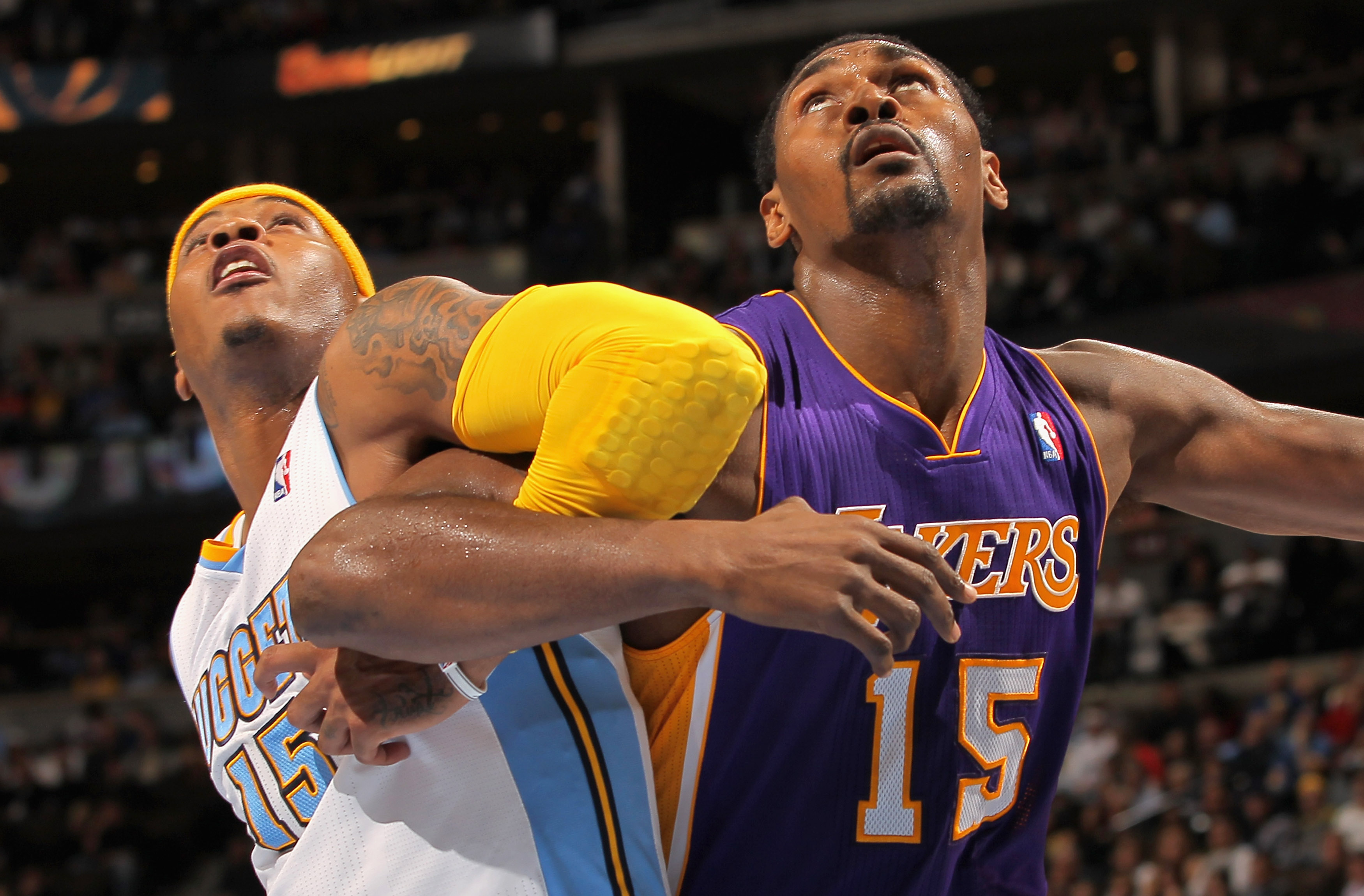 DENVER - NOVEMBER 11:  Ron Artest #15 of the Los Angeles Lakers battles for position with Carmelo Anthony #15 of the Denver Nuggets at the Pepsi Center on November 11, 2010 in Denver, Colorado. The Nuggets defeated the Lakers 118-112.  NOTE TO USER: User