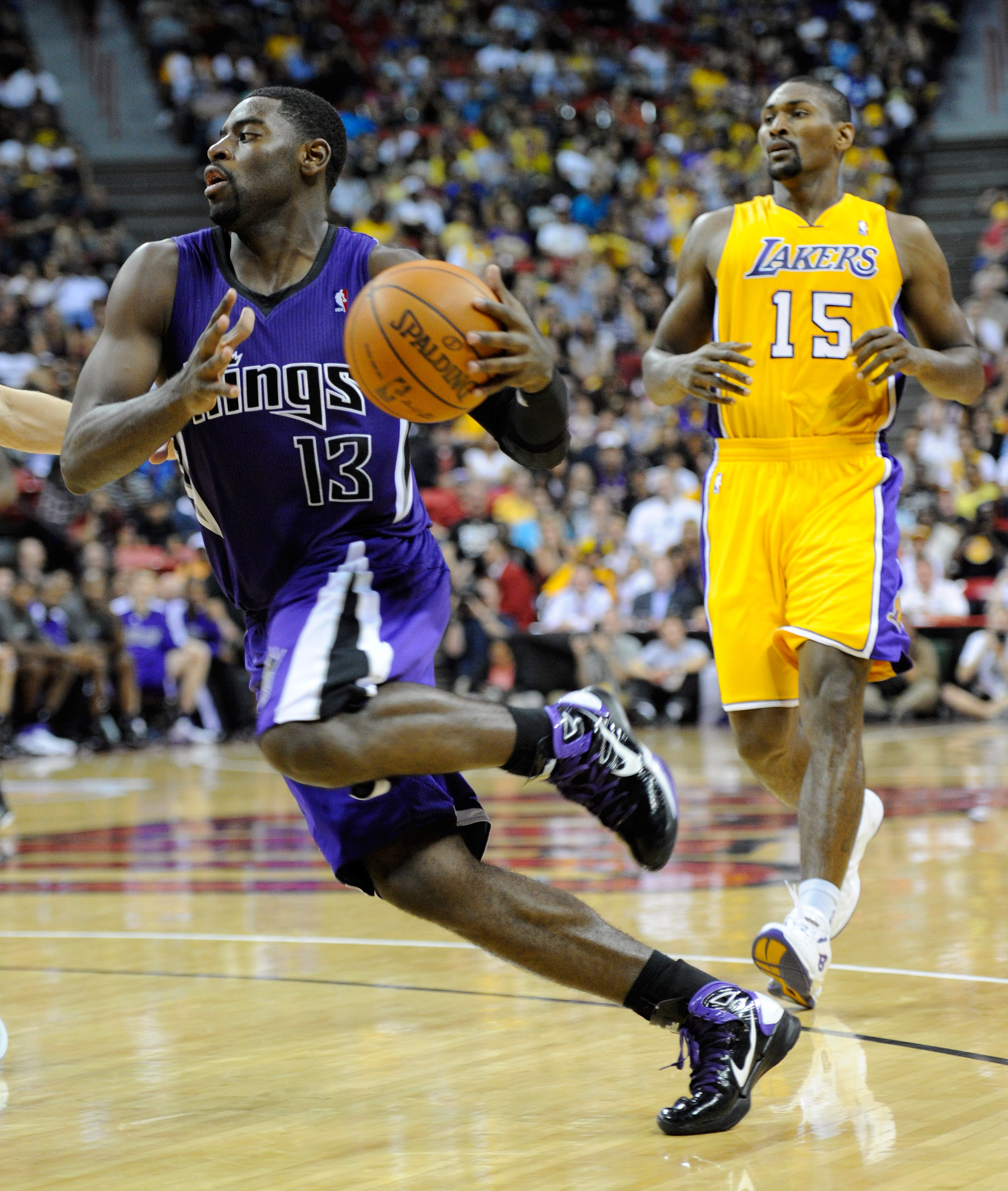LAS VEGAS - OCTOBER 13: Tyreke Evans #13 of the Sacramento Kings drives ahead of Ron Artest #15 of the Los Angeles Lakers during their preseason game at the Thomas & Mack Center October 13, 2010 in Las Vegas, Nevada. The Lakers won 98-95. NOTE TO USER: U