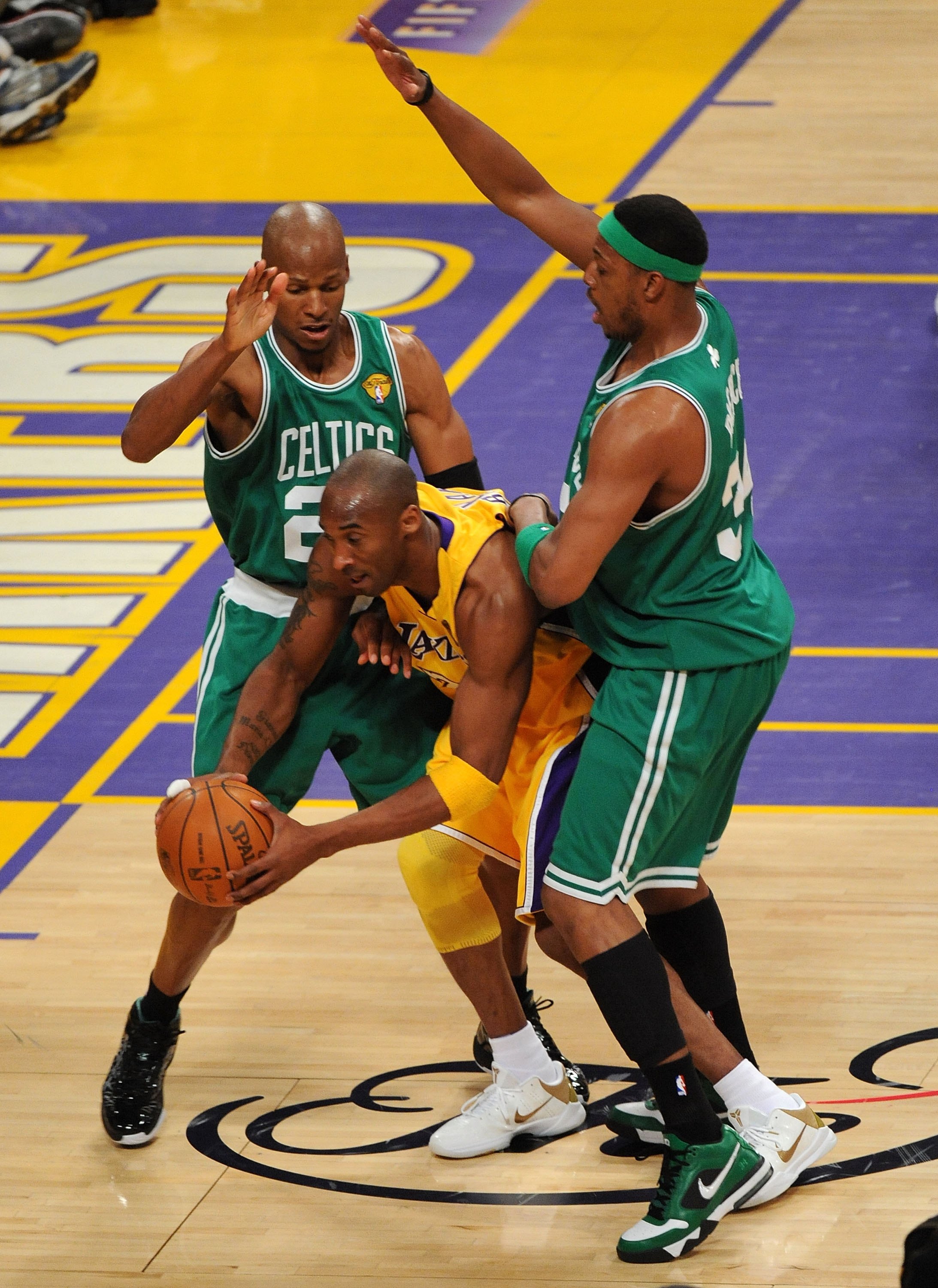 LOS ANGELES, CA - JUNE 17:  Kobe Bryant #24 of the Los Angeles Lakers looks to move the ball as he is double-teammed by Ray Allen #20 and Paul Pierce #34 of the Boston Celtics in Game Seven of the 2010 NBA Finals at Staples Center on June 17, 2010 in Los