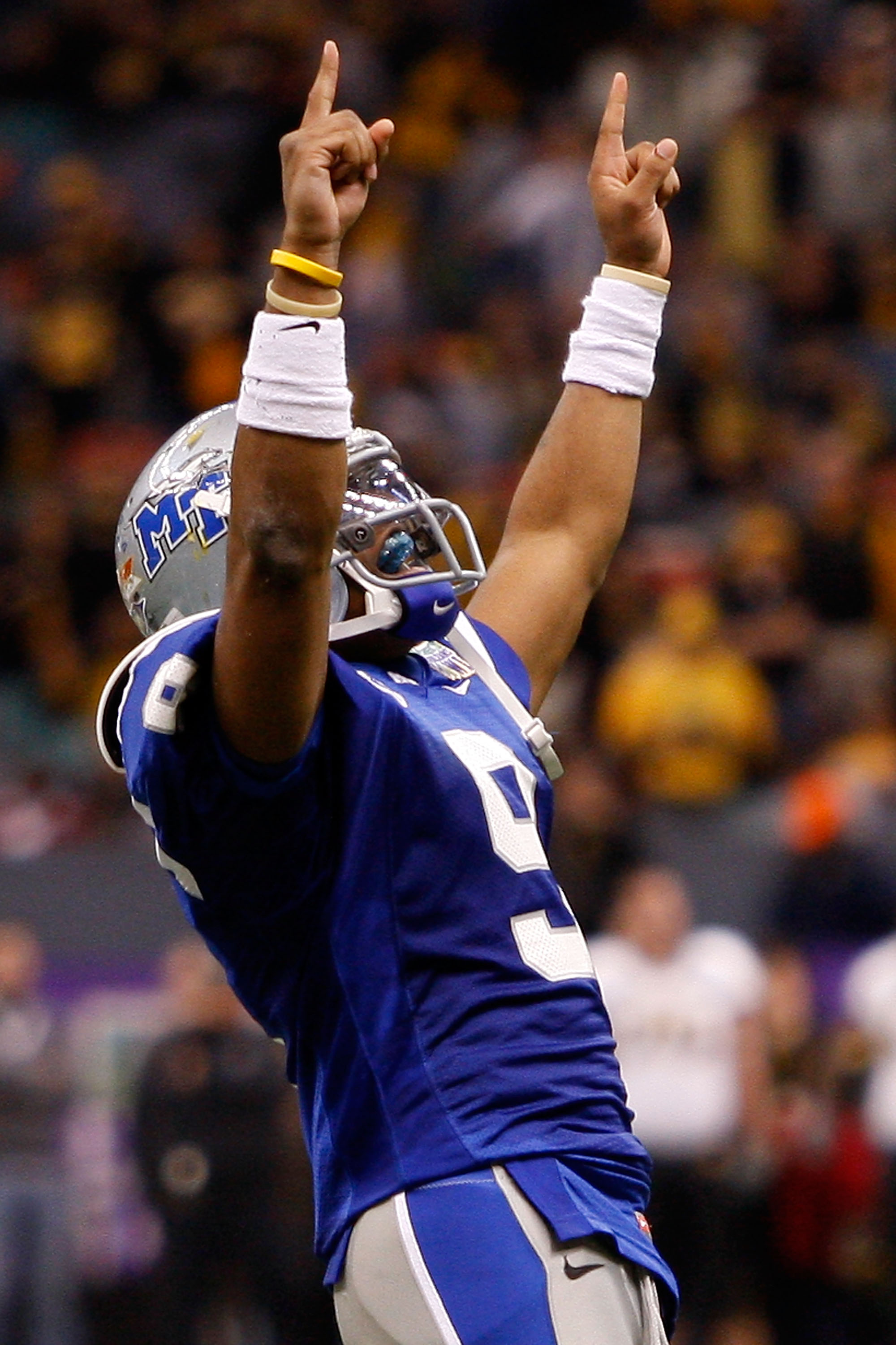 NEW ORLEANS - DECEMBER 20: Dwight Dasher #9 of the Middle Tennessee Blue Raiders celebrates after throwing a touchdown pass against the Southern Miss Golden Eagles during the R+L Carriers New Orleans Bowl at the Louisiana Superdome on December 20, 2009 i
