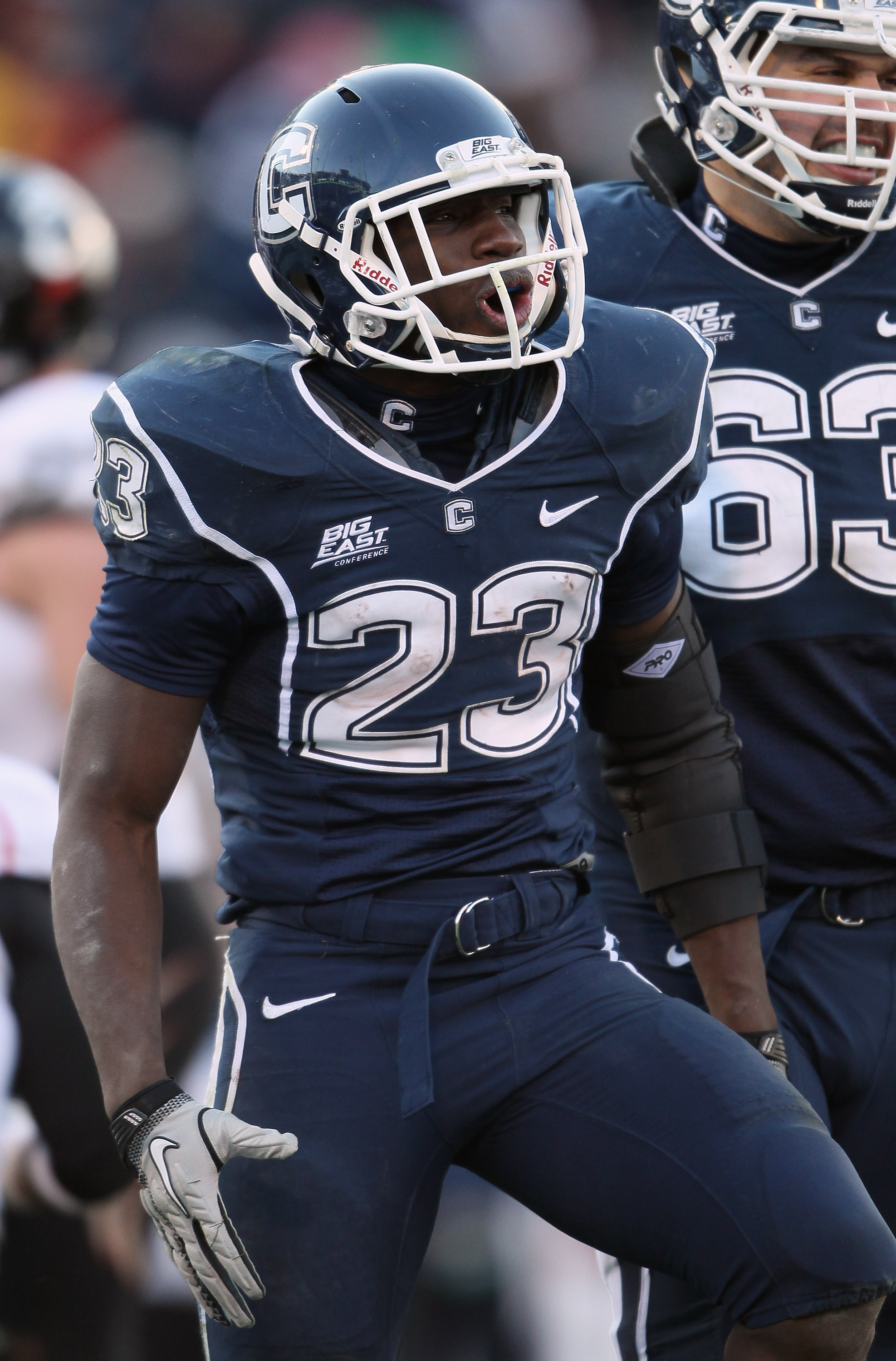 EAST HARTFORD, CT - NOVEMBER 27: Jordan Todman #23 of the Connecticut Huskies celebrates his touchdown in the fourth quarter against the Cincinnati Bearcats on November 27, 2010 at Rentschler Field in East Hartford, Connecticut. The Huskies defeated the