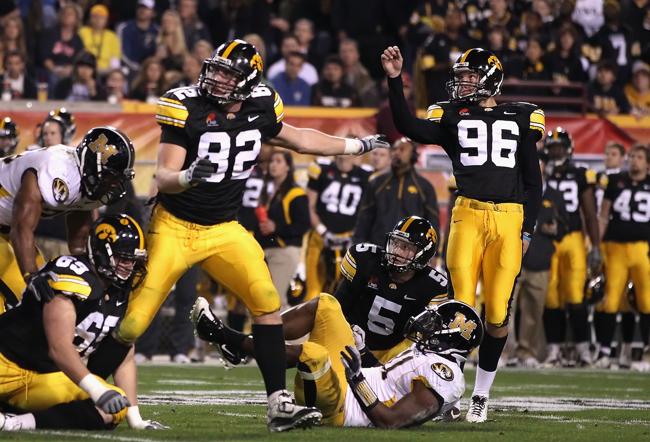 TEMPE, AZ - DECEMBER 28:  Kicker Michael Meyer #96 of the Iowa Hawkeyes kicks a 34 yard field goal against the Missouri Tigers during the Insight Bowl at Sun Devil Stadium on December 28, 2010 in Tempe, Arizona.  (Photo by Christian Petersen/Getty Images)