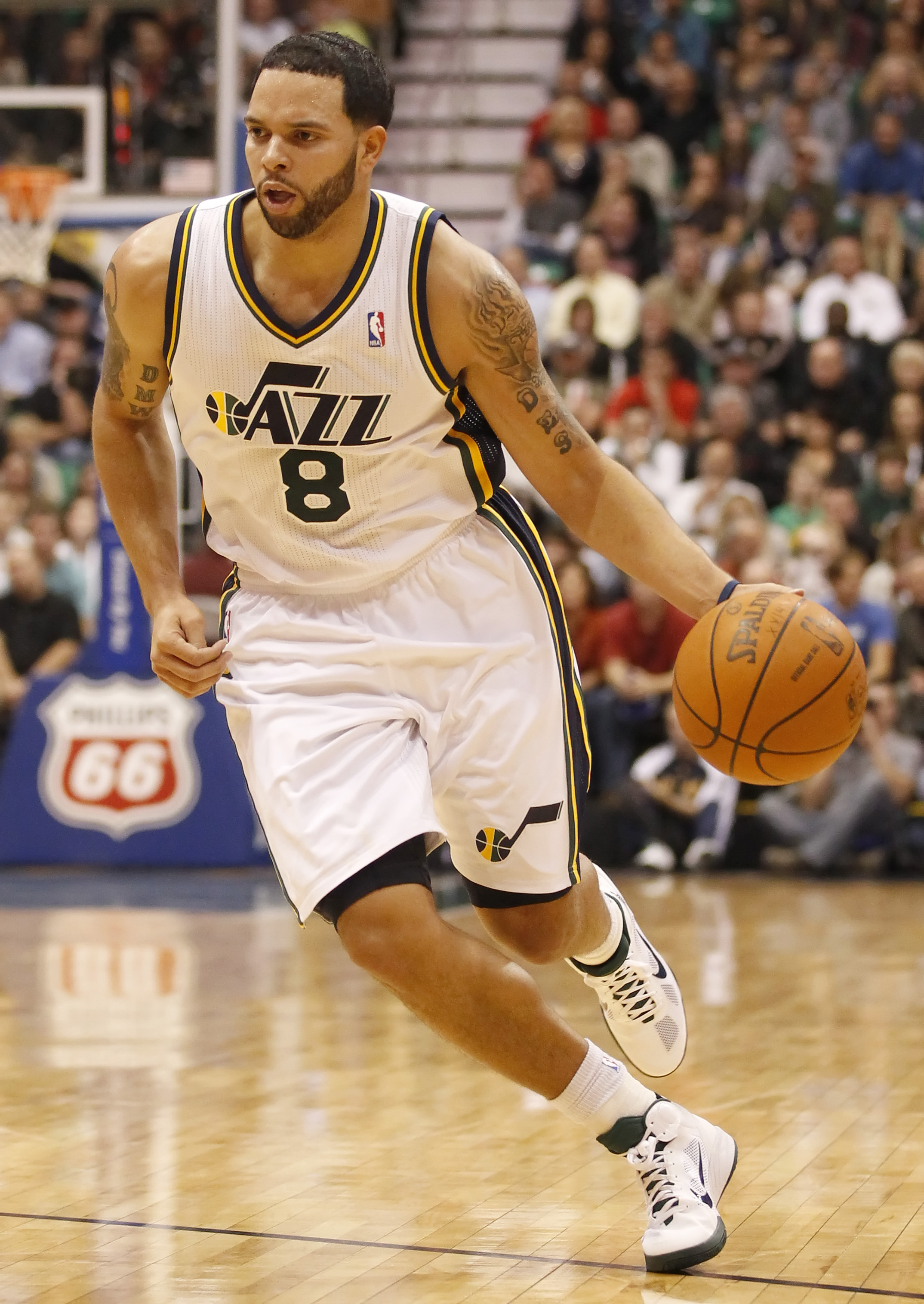 SALT LAKE CITY, UT - DECEMBER 8:  Deron Williams #8 of the Utah Jazz drives the ball down court during a game against the Miami Heat during the second half of an NBA game December 8, 2010 at Energy Solutions Arena in Salt Lake City, Utah. The Heat beat th