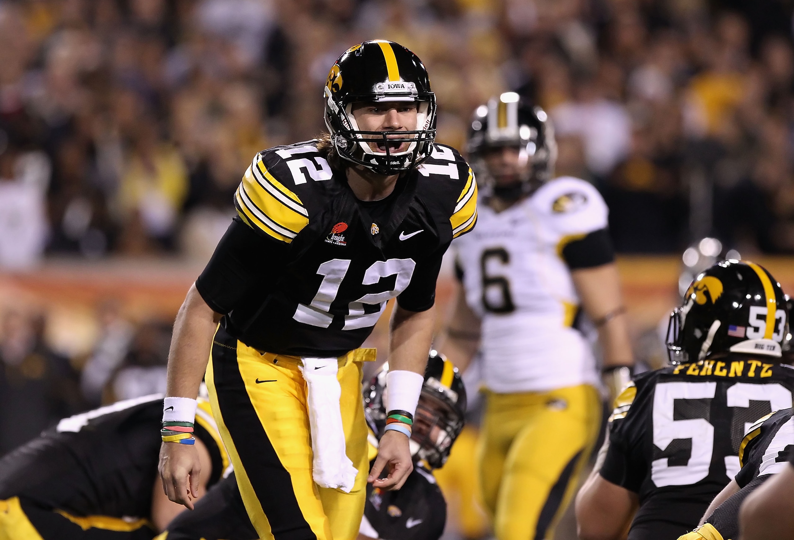 TEMPE, AZ - DECEMBER 28:  Quarterback Ricky Stanzi #12 of the Iowa Hawkeyes calls a play during the Insight Bowl against the Missouri Tigers at Sun Devil Stadium on December 28, 2010 in Tempe, Arizona.  (Photo by Christian Petersen/Getty Images)
