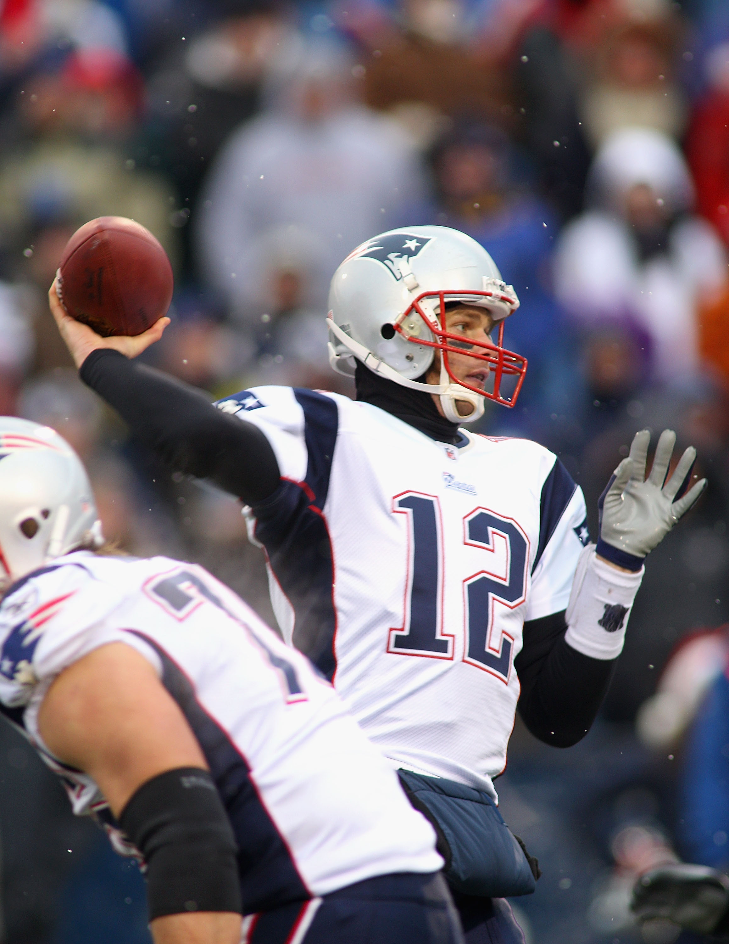 New England Patriots quarterback Tom Brady (12) hands off to running back  BenJarvus Green-Ellis (42) in fourth quarter action against the Washington  Redskins at FedEx Field in Landover, Maryland on Sunday December