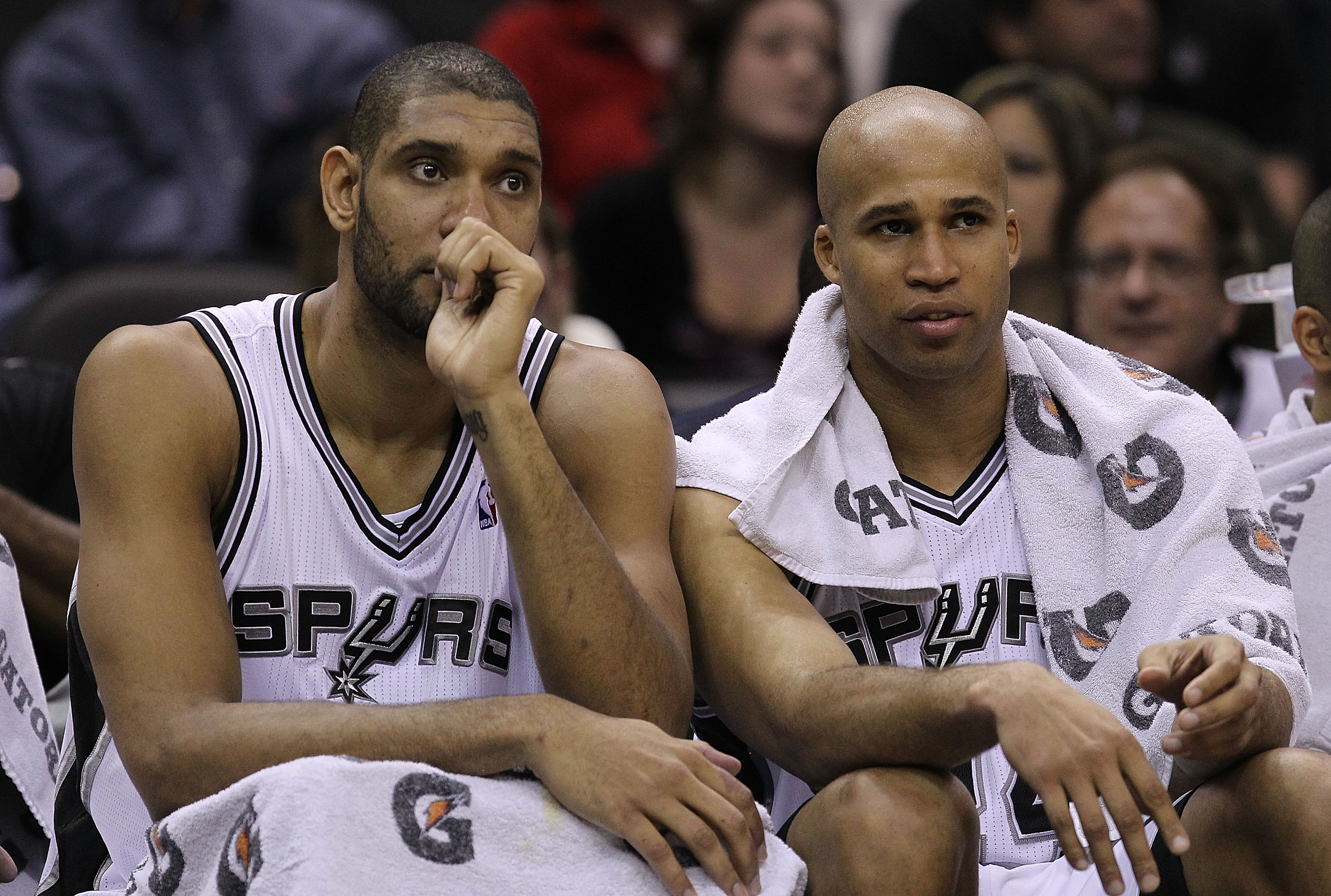 San Antonio Spurs center Tim Duncan watches from the bench in